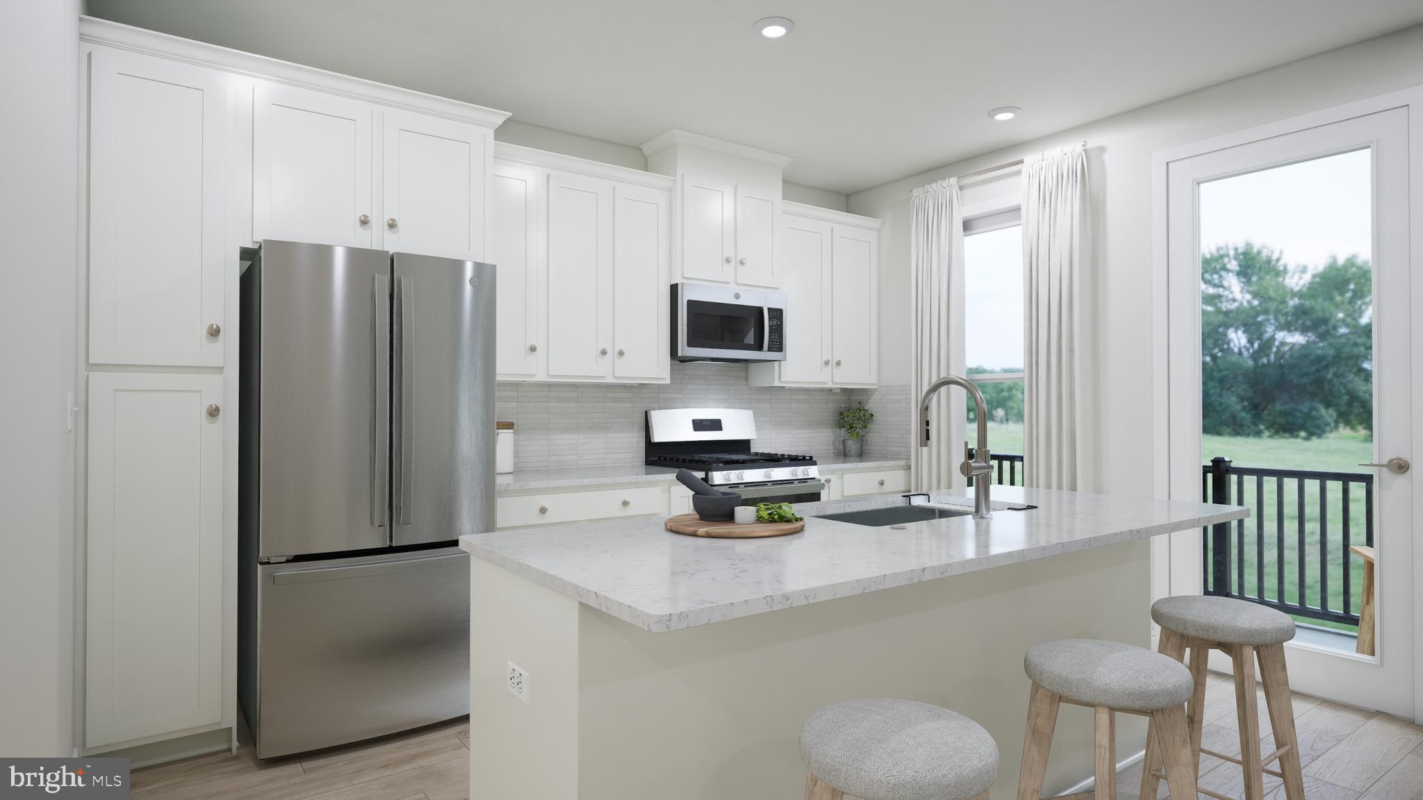 This brand new incredible TOWNHOME-STYLE CONDOMINIUM by Van Metre Homes at DEMOTT & SILVER is available for you to call home IMMEDIATELY! With 2,212 finished square feet on 4 levels, this newly completed CAMERON floorplan by Van Metre Homes offers 3 BEDROOMS, 2 FULL AND 1 HALF BATHROOMS, and a 1-CAR GARAGE. With an abundance of natural light, the MAIN LEVEL showcases a spacious chef-inspired kitchen featuring upgraded cabinets, quartz countertops, stainless steel appliances, and wide Luxury Vinyl Plank (LVP) flooring in central living areas and primary bedroom. This townhome-style condominium features an impressive primary suite with a walk-in closet and a luxury bathroom with double sinks, soaking tub and large shower with built-in seat. The home lives like a townhome, but has the low-maintenance, easy lifestyle of a condominium. This home is truly a must-see, promising comfort, style, and quality. Schedule your appointment today! ----- Discover Demott & Silver, Van Metre’s exceptional community of townhomes and townhome-style condominiums nestled within the master-planned Broadlands community. This sought-after neighborhood offers unparalleled convenience with walking distance access to Metro’s Silver Line and the area’s most desirable amenities. Residents relish in a host of top-notch amenities across Broadlands, including a clubhouse, fitness center, three pools, tennis courts, vast green spaces, and extensive hiking and biking trails. With shopping, restaurants, Metro’s Ashburn Station, a bus stop, and nearby commuter routes at your fingertips, Demott & Silver is set to become the epitome of a superior community in Broadlands. ----- Take advantage of closing cost assistance by choosing Intercoastal Mortgage and Walker Title. ----- Other homes sites and delivery dates may be available. ----- Pricing, incentives, and homesite availability are subject to change. Photos are used for illustrative purposes only. For details, please consult the Sales Team.