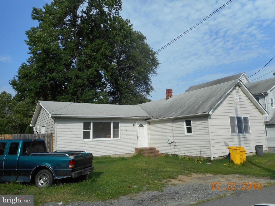 Investor opportunity.  Large 4 bedroom, 2 bath, water access home with over 2000 sq feet is located on two lots in Owings Beach.  Needs some work, but has great potential.  Sold strictly as is - owner will make no repairs.  Just a few homes back from community dock on the Chesapeake.