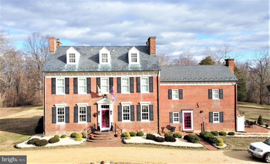 RARE - ONE OF A KIND OPPORTUNITY TO OWN A PIECE OF HISTORY (Circa 1770)! .  This beautifully restored Manor home (Circa 1770) is on the National Register of Historic Places. Situated on 40 beautiful acres, it features impeccably manicured lawn & garden area with a large gazebo, Koi pond with waterfall feature, fountain, beautiful paths, riding trails and woods   an outdoorsman s delight! Also, there is a 3-car detached garage with great storage area in the rafters and an older Tobacco barn on the property! There is a Carriage home (with 2 horse stalls) and a Cottage  each with their own septic system, which offer income producing rental opportunities as well. This very private property has a long driveway leading to a circular driveway to the Manor home. The all-brick Manor home has 3 levels plus a utility basement and a slate roof. There are 6 Bedrooms, 5 full bathrooms, 6 separate (working) fireplaces (1 of which is propane in the kitchen warming room). This home is in exquisite shape   with beautiful gleaming hardwood floors throughout, high ceilings, extensive crown and chair railings, wainscoting, and entire home is tastefully decorated to speak to the history period. The gourmet kitchen features gorgeous custom cabinetry and a 6-burner propane stove as well as a wine cooler   a perfect gathering place! Beautiful views of the property await you from the tall windows throughout the home. Beautiful hardwood staircases lead you to the 2nd and 3rd floor   where you will find large functioning dormers and some built-in storage. The bedrooms are all generously sized and elegantly detailed. A large family room addition is on the rear of the Manor home featuring soaring cathedral ceilings and unique ceiling fans! It s a wonderful place to sit and relax or plenty of room to entertain guests. There is a side porch and a rear porch and an impeccably landscaped/hardscaped path leading to the gazebo and pond area. Guest House Cottage comes with 1 bedroom with HUGE walk in closet, beautiful brick, hardwood and tile flooring, a Full bathroom, Nice kitchen, and the Dining and Living areas have skylights and a pellet stove. There is plenty of built in cabinetry, lots of windows for natural lighting, beamed ceiling and it s own private patio. The Carriage House/Stable features 2 horse stalls on one side and a 2 story home on the other side with 2 decent sized bedrooms and a bath and a half, as well as a kitchen, great room with fireplace and its own driveway   it s a little ways from the Manor house for privacy! All together this property has 9 bedrooms, 7.5 bathrooms, 7 fireplaces and a pellet stove, plenty of parking and outdoor space! It is a truly one-of-a-kind opportunity! Taking its name from a 1000-acre proprietary manor grant to Nathaniel Truman in 1666, of which this property was a part, Truman s Place is the largest and most sophisticated mid-19th century brick house of its architecture in Charles County The owners are ready to downsize and allow someone else the opportunity to own this little piece of heaven!