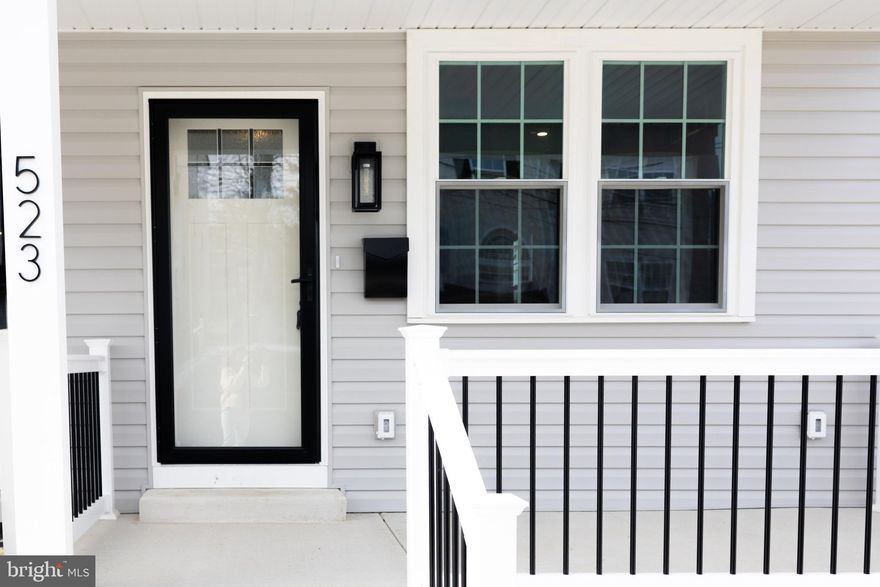 Discover refined modern living in this exceptional new construction home, where elegant design, thoughtful craftsmanship, and everyday functionality come together beautifully. From the moment you arrive, the charming front porch creates a warm and inviting welcome—an ideal place to enjoy morning coffee, unwind in the evening, or simply take in the peaceful surroundings.  Once inside, you’ll immediately notice the incredible natural light streaming through oversized windows that fill every room with warmth and brightness. The thoughtfully designed open floor plan creates a seamless flow between the spacious family room, dining area, and stunning chef’s kitchen—perfect for both relaxed everyday living and effortless entertaining. The kitchen truly serves as the heart of the home and has been beautifully appointed with high-end Wolf cabinetry, gorgeous granite countertops, stainless steel appliances, and a large center island with seating for at least four. Whether you’re preparing a quiet weeknight dinner or hosting friends and family, this kitchen offers both elegance and functionality. Just beyond the kitchen, an exterior door leads to an oversized deck that expands your living space outdoors—an ideal setting for  summer gatherings or simply relaxing in the fresh air. Upstairs, the owner’s suite offers a peaceful and private retreat designed for comfort and relaxation. The spacious bedroom is complemented by a beautifully designed en-suite bathroom featuring a walk-in shower and dual closets with automatic lighting for added convenience. A thoughtfully placed nook with a wall Ethernet connection provides the perfect spot for a home office, study space, or media area. Two additional bright and comfortable bedrooms share a well-appointed full bathroom with a tub and shower combination, completing the second level. The fully finished walk-out lower level provides incredible versatility and additional living space. This expansive area can easily serve as a recreation room, media room, playroom, home gym, or even a private fourth bedroom suite depending on your needs. A beautifully finished full bathroom with an oversized walk-in shower adds convenience and flexibility for guests or extended family. Large sliding doors lead to a covered patio with a custom gutter system, allowing you to enjoy the outdoor space comfortably in any weather.
Practicality meets thoughtful design in the lower-level laundry room, which includes a brand-new washer and dryer along with a utility sink for added convenience. The immaculate utility room features durable epoxy flooring and houses all brand-new, high-efficiency systems including a modern HVAC system and a tankless water heater—ensuring comfort, efficiency, and easy maintenance. The attic also offers excellent additional storage space, providing room for seasonal items and more. Throughout the home, you’ll appreciate the many thoughtful upgrades and finishing touches, including ceiling fans, recessed lighting, dimmer switches, and WiFi extenders installed on every floor to ensure seamless connectivity throughout the entire home. Private off-street parking for two vehicles offers everyday convenience and peace of mind. Even better, there is NO HOA FEE, giving you greater freedom and lower monthly costs.
With its combination of modern luxury, quality craftsmanship, flexible living spaces, and thoughtful details throughout, this exceptional home offers both comfort and sophistication in a setting you’ll be proud to call your own. Ideally located just minutes from King of Prussia Mall with easy access to I-76, I-476, and Route 202, commuting is effortless. Enjoy nearby dining, nightlife, and outdoor recreation at Valley Forge National Historical Park and endless trails just minutes away. A beautifully designed new home in an unbeatable location!