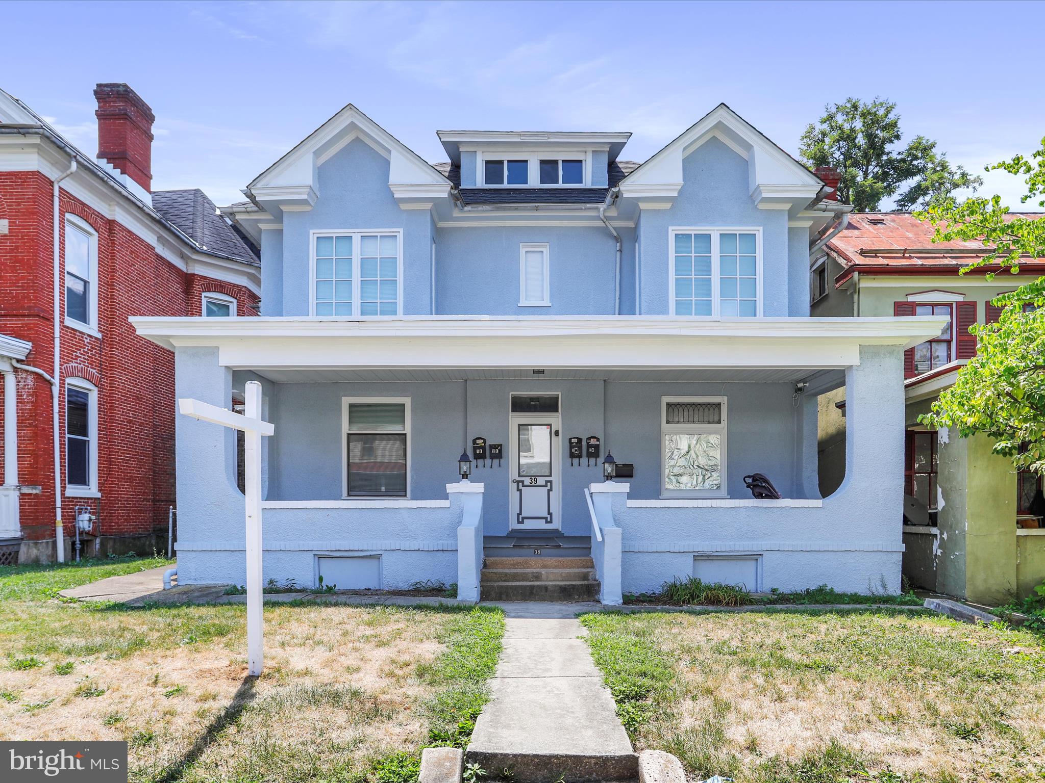 Welcome to this well-maintained 4-unit property, an exceptional investment opportunity with a strong rental history! Fully renovated in 2022. Spacious apartments. Two 2-bedroom units and Two 1-bedroom units. All fully occupied and equipped with washer/dryer units. Monthly gross income is $4,620 for a total $55,440 in annual gross income! Many updates include a new roof, water heater, windows along with original artisan glass windows, updated kitchens with granite countertops, all new appliances, and Mitsubishi mini-split systems. Large basement with old coal bin and chute. Large attic space with windows. Additional rental income from the rear detached 2-car garage. Ample off-street parking space in rear lot. Tenants pay for all utilities. Electric metered separately. Spacious front porch. Each unit has its own rear patio space. Lead-free certification on all units. This property is an excellent addition to any real estate portfolio, offering reliable income and a stable investment. Don't miss out on this chance to own a valuable income-generating asset!