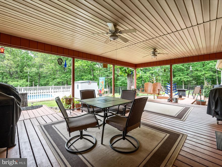 NO HOA/NO RESTRICTIONS!  Motivated Sellers!  Bring your offers! Main Level Living! POOL! 5 GARAGE SPACES, POLE BARN & MORE! Appraised for $646,000!  
Ranch-Style Retreat on almost 8.5 Acres in Frederick County, VA, 20 mins. from Winchester!   Calling all Homesteaders - your Farmette awaits!  This property offers endless possibilities, any type of hobby, gardening, farmette, horses,  workshop, mechanic's shop,  Artist or spa retreat, work remote, etc.  
Hunters - wildlife abounds! The sky's the limit!
Welcome to your private oasis in the heart of Frederick County! Nestled on over 8 partially wooded acres along peaceful Light Road, this beautifully maintained home (with a heated in-ground swimming pool & several out-buildings) offers the perfect blend of rural charm and modern convenience.  Minutes from both historic Winchester and the historic, spa town of Berkeley Springs, WV.  Enjoy the best of both worlds—seclusion and accessibility.  Dulles and Frederick, MD are 90 minutes,  DC and Baltimore -2 hrs.  Within 25 minutes of several golf courses and close to Cacapon State Park. Hiking, fishing, canoeing all within 30 minutes or less.  Vineyards, antiquing, shopping, dining and entertainment all within 20-40 minutes.  So many options for anything that you may want to do.
This large lot sees an abundance of deer, turkeys and other wild life.  An ideal home for nature lovers, hunters, bird watchers or those seeking space to roam.  

Inside the home, step into your Mud room entry, to tuck away all of your outerwear, shoes and wet umbrellas. Your country kitchen and large pantry are immediately off of the mud room and garage, so putting groceries away is a snap!  The kitchen features plenty of counter area for food prep and the perfect space to share a meal or coffee with family and friends.  Off of the kitchen, you'll find a large Dining Room where you may overlook the yard and trees.  The perfect spot for your Thanksgiving meal or celebration!  Off of the Dining Room and Hall is the gem of the home, a large Family Room featuring a vaulted ceiling with a second access point to the deck, inground pool and beautiful back yard.  The fantastic features in this home continue with all bedrooms on the main level.  The Owners suite features a spacious bedroom with gleaming hardwood floors, an expansive double closet and shower bath. Adjacent, you'll find a room that is the perfect office.  Within that room is a recessed stackable laundry hook-up. That space allows for many options - office space and laundry, office, additional storage/closet space and bathroom expansion. 
Down the hallway, along the front of the home, you'll find a Linen Closet and two generously sized Bedrooms with easy access to the beautifully updated hall bath .  
Downstairs features a finished Rec Room and Pellet Stove, a huge work room and storage galore, the laundry area and half bath.  *Washer and Dryer in lower Laundry Room are "as-is".
The property also includes an attached two-car garage, a detached three-car garage, a spacious pole barn and a 12' x 20' shed (all outside structures have electricity).  
Outside, the covered deck, open deck and heated inground pool, beckons in Spring, Summer and Fall. 
The asphalt driveway offers easy access and ample parking for 12+ vehicles, perfect for gatherings or multiple drivers.
A true bonus is the solar panel system (fully owned), offering extremely low electric bills and long-term energy savings.  

Nearby Attractions:
Location, location, location!  Just minutes away, explore local vineyards and farm markets, or take a short drive to Cacapon Resort State Park—a 6,000-acre gem in the West Virginia mountains offering hiking, mountain biking, a championship golf course, lake swimming, horseback riding, and year-round nature programs. It’s the perfect destination for outdoor recreation and family fun.

This is more than a home—it’s a lifestyle. Peace, privacy, and whatever you would like to make it your own.