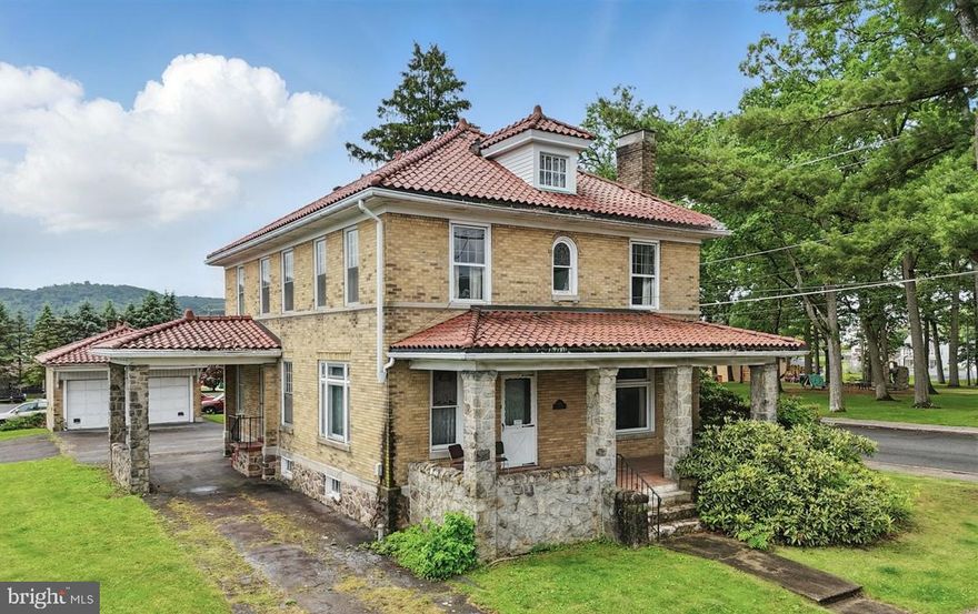 Welcome to this American Foursquare home perfectly situated on a corner lot in the West end of Lehighton. This residence boasts four large bedrooms, two full baths, eat-in kitchen plus dining room, first floor laundry and mud room, sun room, expandable attic and 2 car garage. The beautiful woodwork and elegant details throughout the home add character, highlighting the craftsmanship typical of this architectural style. An efficient gas heating system and fireplace ensure warmth in the colder months and central air will keep you cool in summer. The timeless classic features of the porte-cochère, terracotta roof, the tiled vestibule, cut glass entry door, and crystal door knobs together with your personal updates will make this home feel like a modern manor. Seller offering a home warranty for buyer peace of mind. Call for a walkthrough today, fall in love and make an offer.
