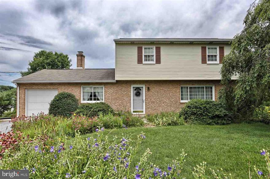 Move in ready, center hall, light filled, traditional home.  Numerous upgrades and improvements have been completed; roof, windows, deck, heat pump have been replaced. Hardwood floors were     installed in LR,DR, and family room. Spacious rooms throughout.Economical gas heat with heat pump back-up.  Hundreds of bulbs and perennials are planted on the spacious 1/3 acre lot.  1 year warranty. Hurry to make this your home.