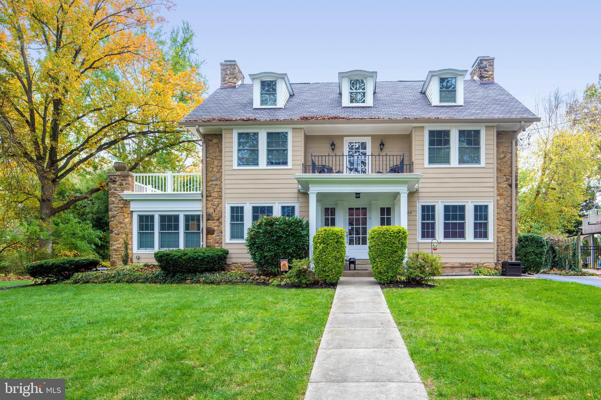 This classic gem is the one you’ve been waiting for, ready to wrap your family in comfort and elegance! Impeccably renovated and modernized by Cunningham Construction, while retaining its unique architectural character and integrity, the 6 bedroom, 4 full/2 half bath stone & siding colonial rests on a half-acre of stunning landscaped grounds. Have the lifestyle you desire in a coveted neighborhood walkable to the town of Narberth, with access to top-rated Lower Merion schools - a huge bonus for those wanting the best of everything. An inviting columned front entry porch, peaceful upper decks, a spacious outdoor patio, and huge private grassy yard where the kids & pets can play add to the appeal. The repaved driveway leads back to a detached 3-car garage with barn-style doors, new cooper flashing, concrete foundation & loft, plus lots of parking for family & visitors. Extensive renovations near $100K include new gutters, added insulation, water softening & whole-house water filtration system, property drainage system, custom-made window well covers, added insulation, a security system & more. Inside is warm and welcoming, with an entry foyer brimming with charm and beautiful details to greet you. Hardwood floors and tasteful moldings/millwork enrich the ambiance, continuing into gracious main rooms. A wide opening spills into a large wainscoted dining room with a corner fireplace and windows on double exposures, making family meals and holidays special. The cook will enjoy creating meals in the gorgeous gourmet kitchen featuring generous wood cabinetry, granite countertops & stainless steel appliances; and the entire family will love sharing casual fare over chats in the sun-filled breakfast room. Relax and host guests effortlessly in the stylish living room, family room and sunroom with fireplaces. Luxury awaits in your wonderful light-filled primary bedroom suite with a vaulted ceiling, adjoining open sitting room with private deck & fabulous custom windowed walk-in closet. Completing the experience is a sky-lit spa bath with a dual sink furniture-quality vanity, jetted soaking tub & oversized glass-enclosed shower. Other highlights are bright well-proportioned secondary bedrooms affording versatility for a work-from-home office, finely-appointed bathrooms, laundry room, central air & a backyard storage shed. Owners are also leaving 3 mounted TVs & a 3-zone Sonos sound system! Who says you can’t have it all, in an unrivaled community. Come see this treasure today!