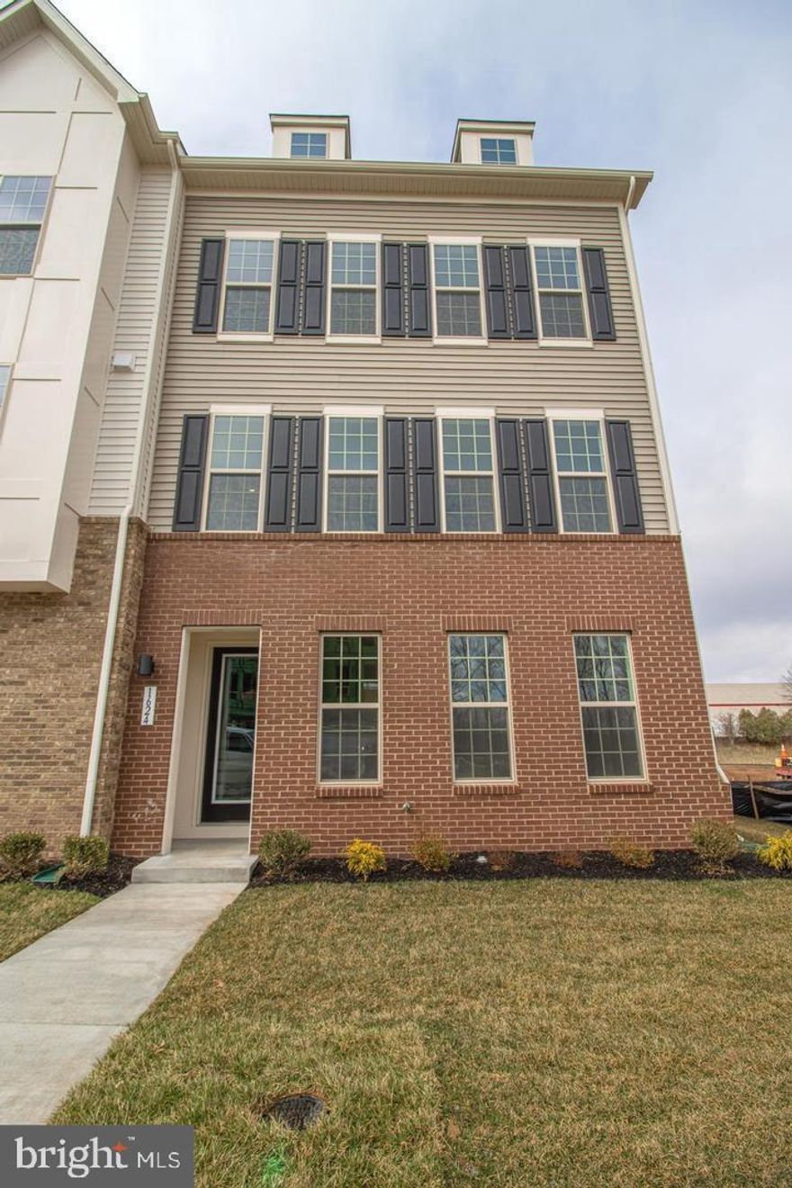 Gorgeous nearly new End unit townhouse in the heart of Leesburg Suburban shopping district. Close to Leesburg Bypass, Rt 15, 267 and Rt 7. 17 minutes to Dulles Airport. This home offers 3 bedrooms, 3 full and 1 half baths. The first floor has a sun-filled rec room, walk in closet and a full bath. The oversized 2 car garage allows plenty of room for 2 cars, plus offers some storage space. Upstairs, the open main floor boasts a great room, dining area, center gourmet kitchen with a large 2 sided island, quartz countertops, 42" cabinets, soft close drawers, & upgraded stainless steel appliances. The foyer along with the entire middle level, and the upper level hallway and staircases are all planked with stunning engineered hardwood flooring. The primary suite offers a large walk in closet with luxurious en suite bath that has dual sinks, private toilet and a gorgeous oversized shower. There are 2 additional spacious bedrooms on the upper level, a full hall bathroom and a laundry closet.
