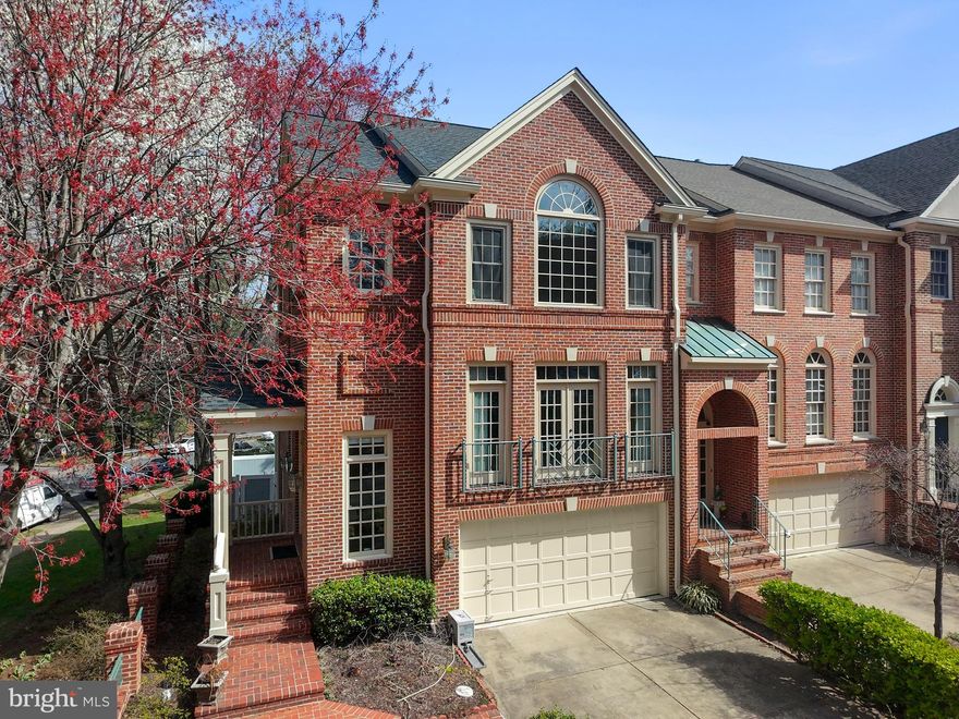 Elegant Williamsburg Brick Townhome in The Mains at Annandale Nestled in a private enclave inside the Beltway, The Mains at Annandale offers timeless elegance and modern comfort in a picturesque setting. This upscale Williamsburg-style brick townhome welcomes you with a charming brick-paved walkway leading to the front door. Step inside to a dramatic foyer with a curved hardwood staircase, setting the stage for the refined interiors. The main level boasts 9-foot ceilings and gleaming hardwood floors throughout the dining room, hallway, kitchen, and sunroom/breakfast area. Start your mornings in the sunroom, bathed in natural light, with a cozy fireplace creating a warm and inviting atmosphere year-round. Overlooking the deck and serene backyard, this tranquil retreat is perfect for relaxing or entertaining. A TV nook is discreetly tucked away for convenience. The gourmet kitchen features a center island with a quartz countertop, a new stainless-steel under-mount sink and faucet, and premium appliances with exterior venting. Adjacent to the kitchen, the step-down living and dining areas exude sophistication, accented by Palladian windows, a French balcony, and elegant crown molding—ideal for hosting gatherings. Upstairs, the primary suite is a peaceful sanctuary, highlighted by beautiful Palladian windows that welcome the morning light. Enjoy the convenience of a built-in coffee bar before stepping into the completely remodeled ensuite bath, featuring designer tiles, double vanities, upscale lighting, and a luxurious soaking tub. Two additional spacious bedrooms include walk-in closets, and a second-floor laundry room adds ease to everyday living. The garden level offers versatility with 10-foot ceilings, a fireplace with gas logs, and rich built-in cabinetry. A full bath makes this space perfect as a rec room, private library, or guest suite. Step outside to a private fenced yard with a brick patio, mature landscaping, and a covered jacuzzi hot tub—your personal oasis. The oversized two-car garage includes a spacious work area, GarageTek storage solutions, and a concrete driveway. Additional home upgrades include: ✔ A.O. Smith Proline hot water heater ✔ Lennox whole-house air purification system (MERV 16 hospital grade filter) ✔ Whole-house AprilAire humidifier ✔ Smart Lennox thermostats ✔ Newer roof & updated windows Prime Location & Convenience: This exceptional home is a two-minute walk to Hidden Oaks Nature Center and just minutes from multiple Fairfax County parks. Commuters will appreciate the easy access to public transportation, with a Metro Bus stop just steps away and Dunn Loring Metro Station less than four miles away. With quick access to I-495, you’re just minutes from Mosaic District, Tysons Corner, the Pentagon, Reagan & Dulles Airports, and the new Amazon HQ2. Northern Virginia Community College (Annandale Campus) is also less than three miles away. Don’t miss this rare opportunity to own a home that blends classic elegance with modern upgrades in an unbeatable location!!