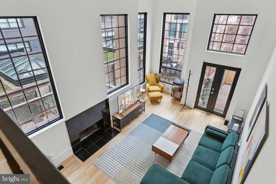 Modern updates in this four level, townhouse-style condo make it the best offering in Logan Circle. Situated in a private courtyard this home’s notable features include oak floors throughout, walls of massive windows, garage parking, and a separate  unit with a Certificate of Occupancy. The living room has two-story ceilings and a fireplace, the kitchen includes Viking appliances and a large island, and the top two floors are comprised of three spacious bedrooms and three bathrooms. The ground floor level has secured garage  car parking and a separate efficiency with a kitchenette and full bathroom (excellent as a rental unit or private guest suite). The 1400 block of Rhode Island Avenue is a beautiful, tree-lined street, ideally located just minutes from Logan Circle, Whole Foods, Vida Fitness, and award winning restaurants and conveniences of the 14th Street Corridor.