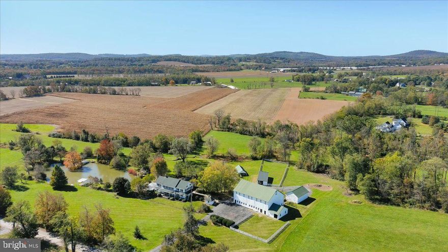 A timeless 58-acre estate in Dillsburg.  Experience the charm of Hickory Row Farm, a rare and remarkable property that feels as if it’s been plucked from a Norman Rockwell painting.   This stunning estate offers an unparalleled opportunity, situated in the scenic landscape of Franklin Township, York County, Pennsylvania.  The property's centerpiece is a beautifully crafted main house, originally constructed around 1930 with wormy chestnut.  Boasting over 4,300 square feet of finished living space, this home invites you to unwind on the expansive covered front porch—perfect for sipping your morning coffee in a rocking chair while soaking in the serene surroundings.  The estate also features one of the larger bank barns of York County with a hayloft and implement storage area, a milk house, and even an original outhouse. As you explore you will find a summer house, dating back to 1836, complete with a wood-burning fireplace and a woodstove insert.  Hickory Row Farm is a haven for nature lovers, offering your own private lake adorned with a picturesque walking bridge, and a dock where you can admire the graceful movements of the resident swans. The property also includes a meandering stream, a pergola, and a gazebo, providing idyllic spots for relaxation and reflection.  The meticulously maintained grounds are truly breathtaking, with an expansive private lawn surrounding the house and additional acreage farmed by a neighboring farmer, who is willing to continue farming under new ownership.   For added peace of mind, the property is equipped with a reliable Generac/Honeywell generator.  One of the most captivating features of the home is the conservatory—a sanctuary where you can immerse yourself in the beauty of every season. Imagine sitting here during the winter months, gazing up as the snow falls onto the glass ceiling and looking out over the snow-covered landscape at the tranquil lake below.  Despite its secluded feel, Hickory Row Farm is conveniently located with easy access to Route 15, making travels to historic Gettysburg, York, Lancaster, Harrisburg, and Carlisle easily accessible. For those yearning for urban adventures, Philadelphia is a two-and-a-half-hour drive away, Baltimore is just an hour and a half, and the vibrant energy of New York City awaits in less than a four-hour journey. Whether you're seeking a sanctuary to call home or a strategic investment opportunity, this property invites you to embark on a journey of limitless possibilities. Whether it’s spring, summer, fall, or winter, this property’s beauty could easily grace the pages of a magazine or be captured on a postcard.  Don’t miss this once-in-a-lifetime opportunity to own a piece of paradise. Hickory Row Farm is more than just a property—it’s a lifestyle.