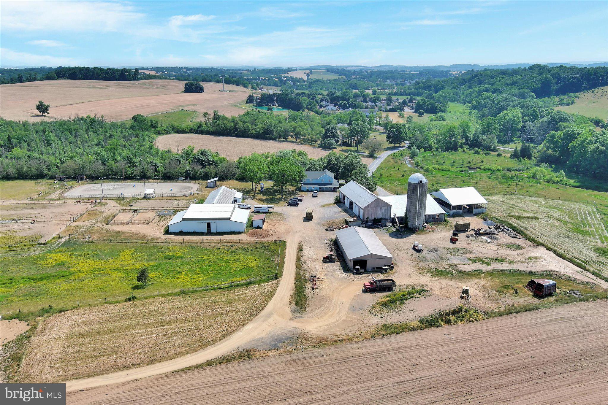 Public Auction - Friday, July 28 @ 2 PM - Successful bidder required a 10% non refundable deposit. Balance within 60 days. Buyer pays the 2% Real Estate transfer tax. List price does not reflect final sales price. * 97 acre horse/beef/crop farm. Traditional farm house style - 5 bedrooms, 2 baths, wrap around porch, 3,216 SF living air, central air. Numerous outbuildings include: 38x94 bank barn w/attached 74x74 steer barn, 34x88 13 stall horse barn w/attached 48x84 riding ring and 8 stalls around the perimeter, 2 tack rooms, 40x80 implement shed, 50x60 manure storage barn (2 years old). Approximately 70 acres tillable, 7 acres in CREP (7 years remaining), balance of land is buildings, barnyard & parking area. A nicely situated farm on a mostly level 97 acres w/creek in the Mohrsville/Centerport/Shartlesville Area. Currently used for horses, but could easily be converted to a steer or crop farm. Flex life water water purifying system for the livestock.