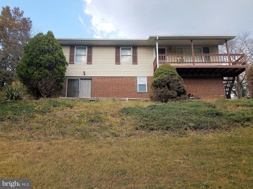 MOVE RIGHT INTO THIS ONE LEVEL 3 BEDROOM HOME FEATURING HARDWOOD FLOORS THROUGH OUT. METAL ROOF UNDER 5 YEARS OLD AND BASEMENT IS READY TO BE FINISHED TO ADD  MORE SQUARE FOOTAGE AND ALSO HAS ROUGH IN BATH. SIDE YARD IS FENCED IN. LARGE DECK OFF REAR OF HOUSE AND FRONT DECK OFFERS AMAZING MOUNTAIN VIEWS. PLENTY OF ROOM TO ADD ON TO HOUSE IF DESIRED.