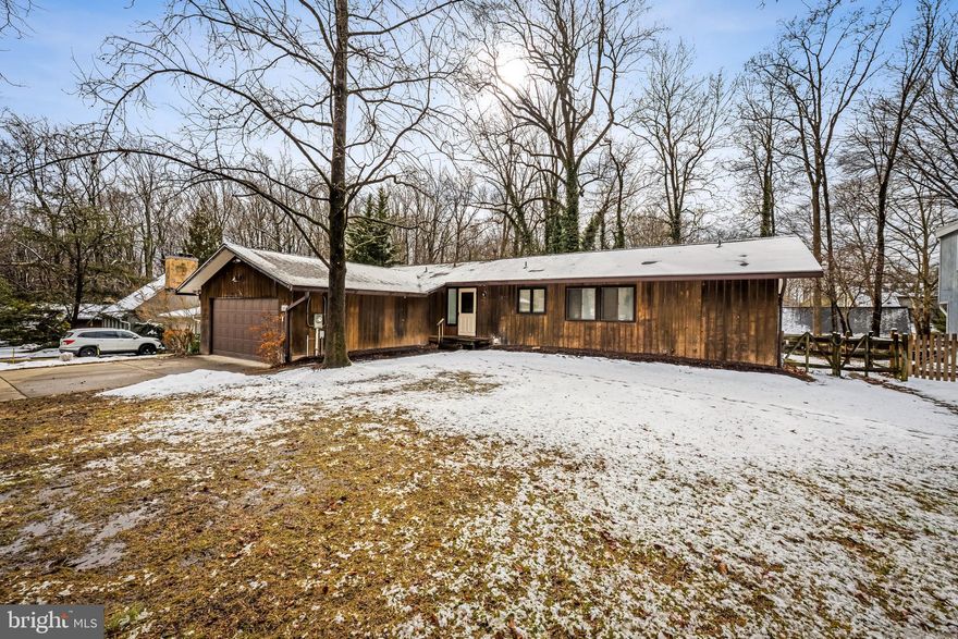 Exceptional Properties. Exceptional Clients. Welcome to 5218 Harpers Farm Road, nestled in the highly sought-after Hobbits Glen neighborhood. This charming rancher offers original hardwood floors and an abundance of natural light throughout. The main level features a bright, open living and dining area that flows seamlessly into a spacious, functional kitchen. The primary bedroom includes an ensuite bathroom and a generous walk-in closet, while two additional bedrooms and a full hall bath complete the main level. Downstairs, the finished lower level provides versatile additional living space, a full bathroom, ample storage, and a dedicated laundry area. Enjoy the privacy of this flat 1/3 acre lot with a large back deck, mature trees, and a fully fenced yard. Updates include a newer roof (2021) and HVAC (2021). Conveniently located close to Hobbits Glen amenities, walking paths, restaurants, shopping and more!