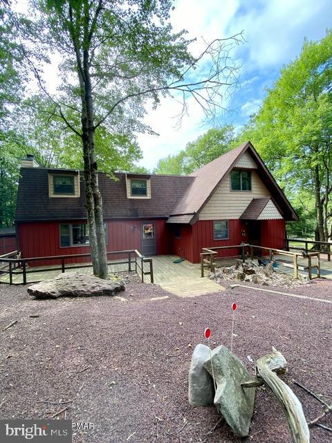 Run! Don't walk to see this one! Looking for a thriving vacation rental business? Or your own mountain escape? This one is a GEM! With a gigantic back deck for parties nestled in the woods. A LARGE living room with a stone faced fireplace and an abundance of natural light. Beautiful hardwood ceilings throughout the home and accent beams giving you a ''cabin in the woods'' feel while enjoying the sprawling reality of this large home. Located in the heart of the Poconos this 4 Bedroom, 2 Bath home in desirable Lake Harmony Estates gives you beach access and boat ramp access to the motor boat 360' lake. Stop dreaming of the Mountain lifestyle and come get a slice of your own paradise. 1.5 hr to NYC, 1 hr to Philly, 30 min to Allentown or Wiles Barre, 7 min to Rte 80, 12 min to Pa Turnpike