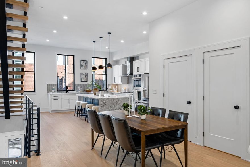 ***ONLY 4 HOMES LEFT*** This collection of 4-story luxury townhomes in Old City—delivering Spring 2026—offers 2-car attached garage parking, a gated drive aisle, 10+ foot ceilings, private outdoor spaces, and stunning skyline and bridge views from expansive roof decks. Set in the historic heart of Old City Philadelphia, the homes feature timeless brick facades that complement the surrounding colonial architecture. Enter through a light-filled foyer with oversized Pella windows and striking black frames. The main level showcases a designer kitchen with Café stainless steel appliances, Bosch dishwasher, quartzite countertops, custom tile backsplash, and high-end cabinetry. The open layout continues through the dining area into a spacious living room with sliding doors leading to a private balcony. The second floor includes two generously sized bedrooms, two full bathrooms, and a convenient laundry area with washer and dryer. The entire third floor is dedicated to a luxurious primary suite featuring abundant natural light, walk-in closets, and a spa-like bathroom with heated tile floors, a freestanding soaking tub, and a large glass-enclosed shower with body sprays. Above, the pilot house leads to a roof deck with incredible views of Old City, the Benjamin Franklin Bridge, and the Philadelphia skyline. The finished basement, complete with a full bathroom and 10’ ceilings, offers flexible space for a home office, guest suite, or playroom. Additional features include multi-zone HVAC, smart home technology (Ring doorbell, Nest thermostats, and Schlage keyless entry), and thoughtful design throughout. Enjoy close proximity to the waterfront, local dining, shopping, and easy access to I-95, all within the McCall Elementary School catchment. Each home includes a 10-year real estate tax abatement and a 1-year builder warranty.  ***Taxes and square footage to be independently verified. Photos are of a model unit; floor plans and finishes may be different***