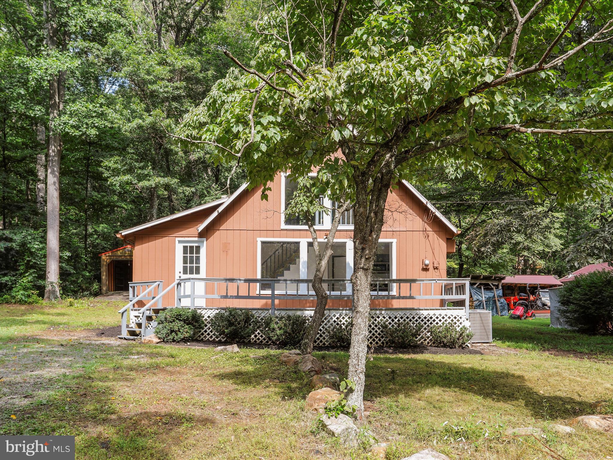River life! This newly renovated chalet is placed right on the Cacapon River with year round views and a common area with a launch! Not in the flood zone! Peaceful, dead end road with only a handful of houses, come check out your new getaway. The home features lots of new items like paint, flooring, bathroom, kitchen, appliances and more. 1 bed 1 full bath on the main level with a 2nd story loft bedroom. The community common area with water access within site of the house, easy short walk to get there!