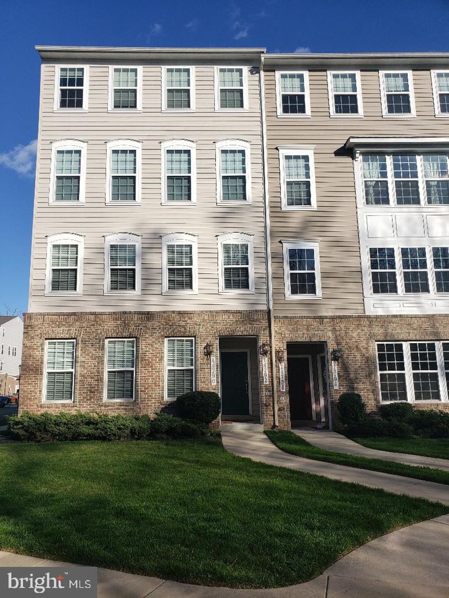 This lovely home features an open floor plan with attractive floors on the main level that boast an upgraded kitchen with granite countertops, stainless steel appliances, subway tile backsplash, and an island. Convenient rear garage and an adorable half bath on the main floor. The upper level features a spacious and open loft with access to a sunny balcony that provides abundant natural light. Next to the loft is a secondary bedroom, hall bath, and a large master bedroom with upgraded tiles in bathroom, and TWO large walk-in closets! This home has tons of light with many windows. Meticulously maintained with upgrades ready to be enjoyed!! Located minutes from Wegmans, shopping, VRE, and Potomac Mills.