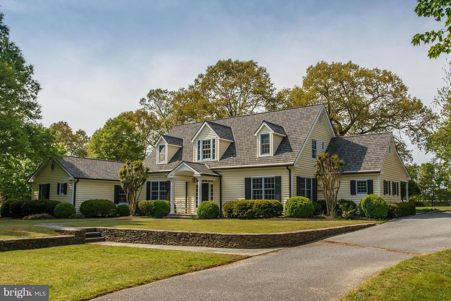 Stunning waterfront retreat nestled on a 5-acre private point on Langford Creek.  The gorgeous, custom built home offers incredible attention to detail, beautiful hardwood floors, gourmet kitchen, private guest quarters and a wonderful water view conservatory.  The property also features a deep water dock with lifts, private beach, boat shed, 31x24 barn and carriage house above a 4-car garage.