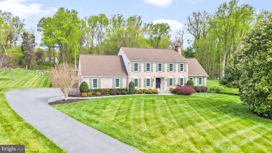 This extraordinary residence offers a level of peace and refined tranquility seldom found. Gracefully set upon 2.25 pristine acres, this distinguished brick-front colonial in Plainfield Orchards presents 4 bedrooms, 3 full bathrooms, and over 4,300 square feet of beautifully appointed living space. Bathed in natural light, the main level showcases rich wood flooring throughout, complemented by elegant formal living and dining rooms. At the heart of the home lies a truly exceptional kitchen—designed with both beauty and function in mind—featuring an abundance of prep and storage space, stainless steel appliances, generous bar-top seating, and picturesque views of the expansive grounds. Seamlessly open to the inviting family room, this space is anchored by a striking fireplace, creating the perfect setting for both grand entertaining and intimate gatherings. The upper level offers four generously proportioned bedrooms and two full bathrooms, including a luxurious primary suite complete with a spacious walk-in closet and a spa-inspired ensuite bath.  The lower level continues to impress, featuring a second fireplace, an expansive recreation room, and an additional full bathroom—ideal for guests or extended living.
Outdoors, the property transforms into a private sanctuary. Enjoy the elegance of a sprawling deck, two charming gazebos, and a breathtaking pool-and-spa combination, all set amid a fully fenced yard and serene, tree-lined vistas that ensure the utmost privacy. A rare offering of sophistication, comfort, and timeless appeal—this remarkable home is not to be missed.