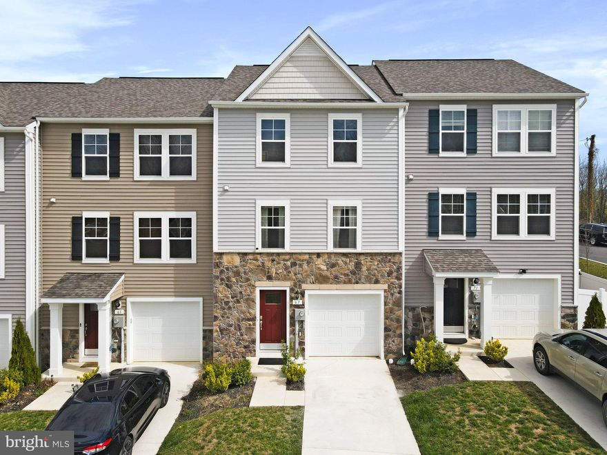 WHAT YOU HAVE BEEN WAITING FOR a 2 year 5-month young DRB York II Garage Townhome. Better than new as you can occupy upon closing. You will be delighted to see how well this 3 bedroom, 3/1 Bath shows.   Many UPGRADES were added upon construction, A unique attribute is the long driveway & nice size front yard. A wide-open foyer greets you as you enter with an oversized coat closet.  There is a full bath on the entry level, this area could be restructured to be another bedroom if desired. An additional bump out 11'1" x 7'x5"space was added creating a Morning Room next to the kitchen, extra space in primary bedroom, & more sq. footage in the recreation room.   Upgraded carpeting, /padding, LPT, and tile package.  In the kitchen upgrades include island with pendant lights, granite counter tops, upgraded 42-inch kitchen cabinets, 25cu French SS refrigerator, and stainless-steel appliances.    The home features 9 Ft Main level Ceilings! 5 Ceiling Fan Pre-Wire (3 Bedrooms, LV, Morning Room) a Beautifully appointed Primary Bath with the desired soaking tub, upgraded cabinets, and double sinks.  Washer and drier are on the upper bedroom level. You will find these features brings this property into the standard of buyers' expectations. This property does not back up to other homes, and extra parking is not assigned near the home. The property has great light and is decent distance from TH across the street. Do not miss putting in an offer on this Beautifully appointed  townhome!! Are you Ready to move? No waiting for construction to be completed, it is ready for you to fall in love with.