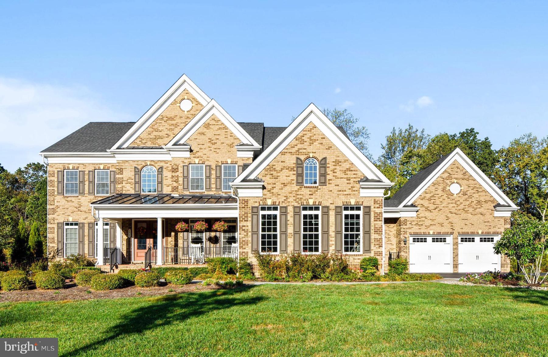 This stunning colonial in the Summit at Copper Ridge offers over 7,500 square feet of immaculately finished living space. Just three miles from Annapolis, this 5 bedroom, 6.5 bath home offers easy access to all downtown Annapolis has to offer, in a secluded and private setting. The front doors open to an impressive two story foyer with crown molding and a gorgeous chandelier. The main level offers an open floor plan with a two story foyer and living room, and ten foot ceilings in the kitchen, dining room, office, and in-law suite. The kitchen includes two huge islands with bar seating, GE Monogram stainless steel appliances, granite countertops, as well as a large eat-in area. The formal dining room offers a tray ceiling, butler's pantry, and wainscoting. The office has extensive built-ins with cabinetry and shelving. The kitchen leads out to a large deck overlooking a 36 acre land preserve area that will never be developed. The master suite offers a tray ceiling, large sitting room that walks out to a private balcony, master bath and huge walk-in closet. The basement includes a large family room with propane fireplace, and a full bar with sink, wine fridge, dishwasher and bar seating. Basement also offers pool table area, exercise room, and sauna room. The deck stairs lead to a stunning pool and hardscape patio. It's the ultimate outdoor entertainment space with over 1,000 square feet of paver patio space surrounding an amazing heated pool with three waterfalls and extensive landscaping. Also included is hot tub and fully fenced back yard. Too many details to list, it must be seen to be appreciated. This is a show stopper of a home.