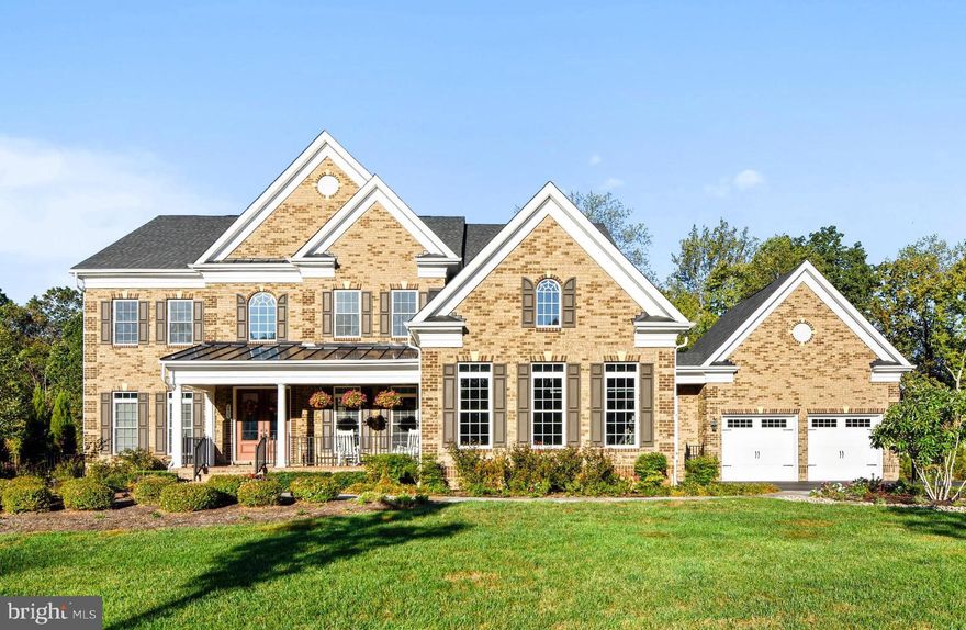 This stunning colonial in the Summit at Copper Ridge offers over 7,500 square feet of immaculately finished living space.  Just three miles from Annapolis, this 5 bedroom, 6.5 bath home offers easy access to all downtown Annapolis has to offer, in a secluded and private setting.  The front doors open to an impressive two story foyer with crown molding and a gorgeous chandelier.  The main level offers an open floor plan with a two story foyer and living room, and ten foot ceilings in the kitchen, dining room, office, and in-law suite.  The kitchen includes two huge islands with bar seating, GE Monogram stainless steel appliances, granite countertops, as well as a large eat-in area.   The formal dining room offers a tray ceiling, butler's pantry, and wainscoting.  The office has extensive built-ins with cabinetry and shelving.   The kitchen leads out to a large deck overlooking a 36 acre land preserve area that will never be developed.  The master suite offers a tray ceiling, large sitting room that walks out to a private balcony, master bath and huge walk-in closet.  The basement includes a large family room with propane fireplace, and a full bar with sink, wine fridge, dishwasher and bar seating.  Basement also offers pool table area, exercise room, and sauna room.  The deck stairs lead to a stunning pool and hardscape patio.  It's the ultimate outdoor entertainment space with over 1,000 square feet of paver patio space surrounding an amazing heated pool with three waterfalls and extensive landscaping.  Also included is hot tub and fully fenced back yard.  Too many details to list, it must be seen to be appreciated.  This is a show stopper of a home.