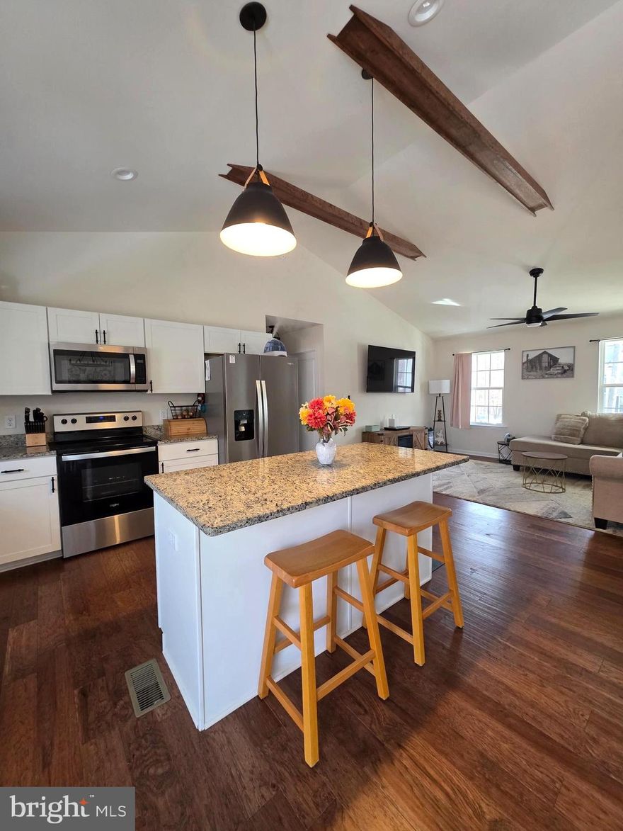 LAKE LIFE IS CALLING — AND IT’S RIGHT IN YOUR BACKYARD.
**BOAT SLIPS AVAILABLE THROUGH THE HOA, ANNUAL BASIS**

Why just visit Lake Anna when you can live it every single day? Welcome home to this stunning home built in 2024. Perfectly positioned to embrace everything Lake Anna has to offer. With over 13,000 acres of water, adventure, and relaxation just minutes away, your backyard becomes your gateway to boating, fishing, waterfront dining, marinas, wineries, festivals, and endless summer sunsets.

This beautiful 5-bedroom, 3-bath home sits on nearly an acre, offering the space and privacy you want with the lake lifestyle you’ve been dreaming of. Designed with both elegance and comfort in mind, the open-concept floor plan is filled with natural light and anchored by soaring vaulted ceilings accented with warm stained wood beams.

The chef’s kitchen is the heart of the home, featuring granite countertops, stainless steel appliances, oversized island and a farmhouse sink that blends charm with modern function. Rich hardwood floors flow throughout the main living areas, while the tastefully tiled bathrooms showcase meticulous craftsmanship, including a luxurious free-standing soaking tub in the master bathroom/spa, perfect for unwinding after a day on the water.

The fully finished basement expands your living space with 2 additional bedrooms (1 NTC), full bath, office/flex room, and a spacious recreation area ideal for hosting friends after a full day at the lake.

With approximately 2,800 square feet of thoughtfully designed living space and a spacious backyard ready for gatherings, firepits, and future possibilities, this home offers the perfect balance of peaceful retreat and vibrant lake lifestyle.

Pointers we don't want to forget about is this home has a convenient 50-amp generator connection installed for whole-home backup capability, Custom programmable exterior lighting across the entire front of the home with remote color control, Full-perimeter gutter guard system installed.

Live where others vacation.
Make Lake Anna your everyday backdrop.