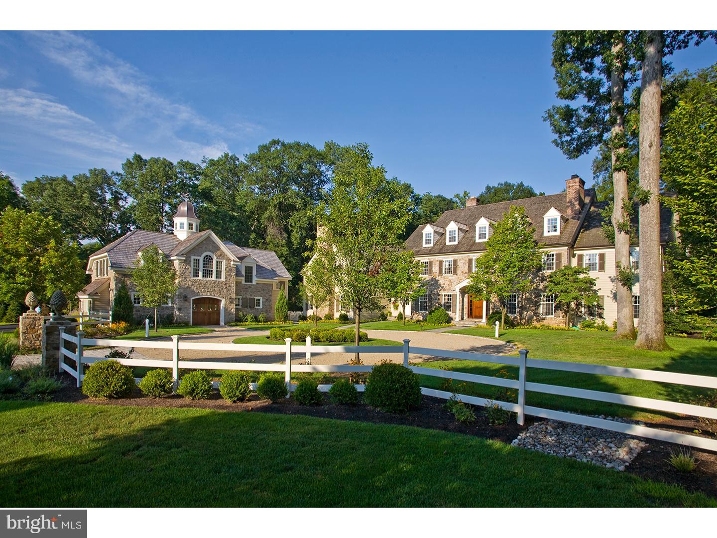 This magnificent country estate on a prime 8 acre property has been totally renovated and redesigned with the best of everything! The classic stone and frame home with long circular driveway approach offers 5 Bedrooms, 5.2 baths, a Carriage Garage and apartment, pool, pool house, lanai, restored stone wagon shed & total privacy. The attention to detail throughout includes gorgeous millwork, wainscoting, raised paneling, coffered & reclaimed beamed ceilings, richly-stained oak & heart pine floors, tall ceiling height, 5 FP's, deep sill windows, & exquisite kitchen & bath designs w/fixtures by the likes of Waterworks & Barber Wilson. The formal rooms are gracious w/large thresholds allowing flow from room to room. The family/gathering room is a showstopper w/a 2-story coffered ceiling, 2-story stone fireplace, & walls from floor to ceiling w/panels of birds eye cherry. The country kitchen w/ warming brick fireplace & dining area is outfitted w a Wolf 6-burner gas range, Miele Dishwasher, large center island, rich cherry & granite counters, & a handy Butler pantry w/ Fisher/Paykel & Scotsman appliances nearby. A grand Game Room offers a bar by William Draper, wood FP, & huge entertaining spaces. Outside is a private garden. The main level also has a handsome library w/FP, & a convenient en-suite bedroom w/full bath. There are Pella windows and doors galore! On the 2nd floor, the main bedroom suite is enhanced by a dressing closet, & a full bath is outfitted w/an"air" tub, & large shower w/rain shower feature. Two BR's are en-suite w/ gorgeous millwork, tubs, marble vanities & floors; another BR has access to nearby bath & secondary staircase. A whimsical playroom is finished w/ a built-in play house, & sliding barn doors to a BR w/2 sets of bunk beds! The finished 3rd floor offers open, carpeted space w/ dormers & storage. And the finished lower level has arts & crafts & media rooms, a gym w/rubberized floor, & climate controlled wine cellar (1000 bottles). A heated 3-4 Carriage garage is highlighted by a 2nd floor apartment/office w/cathedral ceiling, kitchenette, belvedere, & full bath w/ shower. Outside is a pool & spa, lanai w/ fireplace, & a pool house w/half bath & outdoor shower (hot & cold water!) An expansive blue stone patio w/b-in gas grill enjoys views of the private property complete w/ stream & walking bridge. Natural gas heat, a b/up whole house generator, flat screen TV's & sound systems & award winning NH/SO schools. Simply sensational!