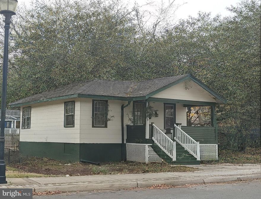 Super charming 3 bedroom  2 bath house with original chestnut woodwork!!   Gleaming hardwood floors!!  Full basement with lots of storage space,  freshly painted exterior  -  Move in ready condition!!    10 x 25 kitchen with 8 foot pantry + Backsplash!!     7 x 15 front porch!!   Great location near Whole Foods, Walking trails + the Purple line Metro!!  Off street parking for 3 cars!!   Southern exposure!   Across from the Historic Riversdale Mansion!!   Gas heat + gas cooking!   Lots of built in shelving,  Congoleum tile floor in bathroom,  Rain Garden in backyard,  Leaf Guard gutters a couple years ago (lifetime warranty),    Recessed lighting!   Transom window + more!!