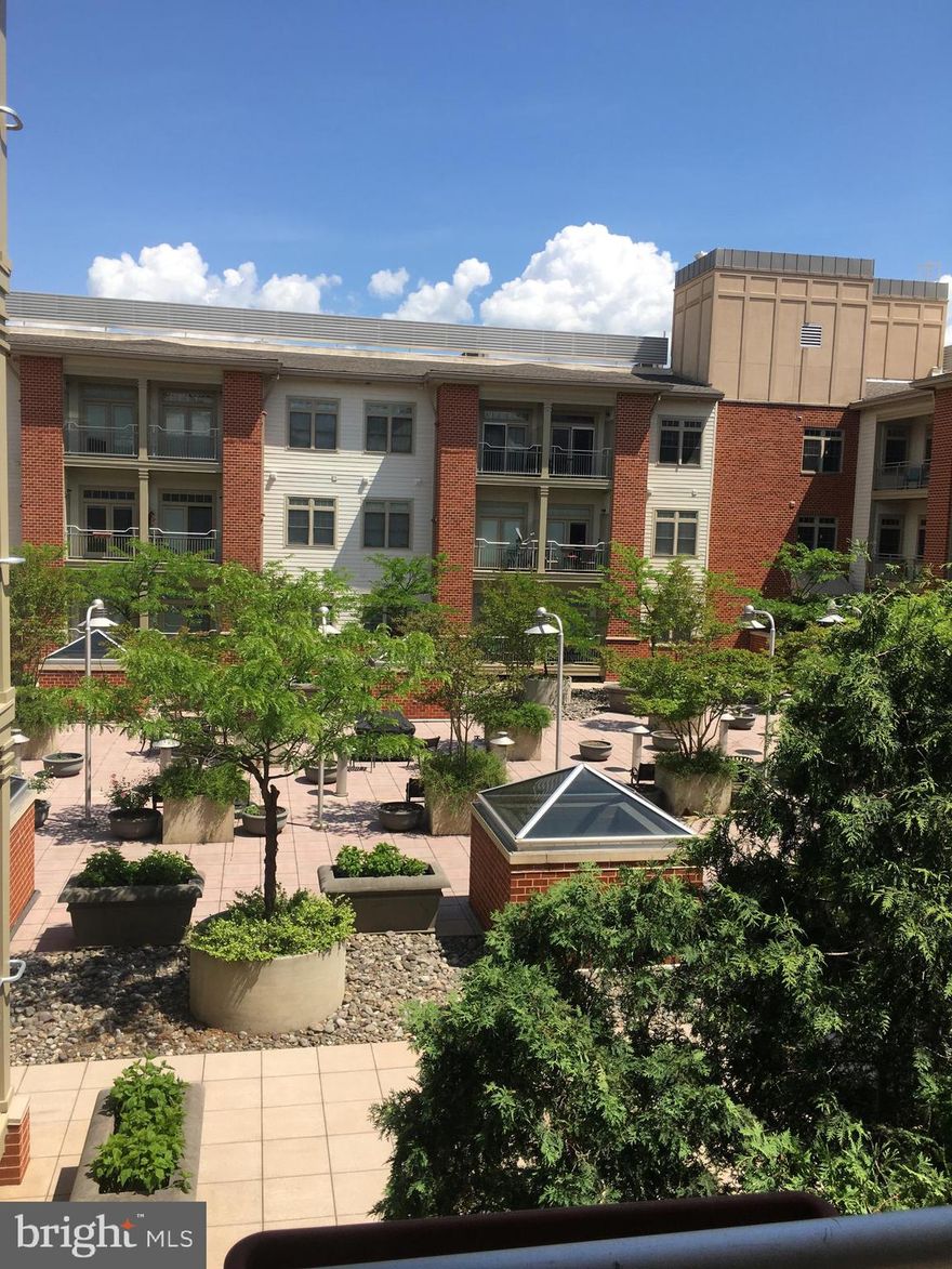 A five-minute walk to the King Street metro, 2 blocks to the restaurants, shops and hustle and bustle of King Street and located in the Whole Foods building are enviable features of this beautiful condo at the Royalton! Over 100 square feet larger than the one-bedroom condos at the development, this unit, with 752 square feet, allows for living, dining and office space.  The heat and hot water are included in the rent.  There is a washer/dryer in the unit and a one-car garage space in the secure parking garage comes with the unit.  There are upgraded hardwood floors throughout, stainless-steel appliances in the kitchen, granite countertops in the kitchen and bath and a walk-in closet. The condo will be freshly painted! Beautiful light throughout! The balcony faces south and east into the private courtyard.  Exit steps are right next to the unit and the exercise room is right downstairs! OLREA. Move-in fee: $500.