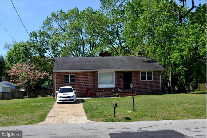 All brick rancher with large lot! First floor includes living room with wood burning fireplace, dining room, bonus room, kitchen, 2 bedrooms and one bathroom.  Laundry area is located in the unfinished basement that also has outside access. Located within walking distance to the water and community offers a pier, playground, and boat ramp.