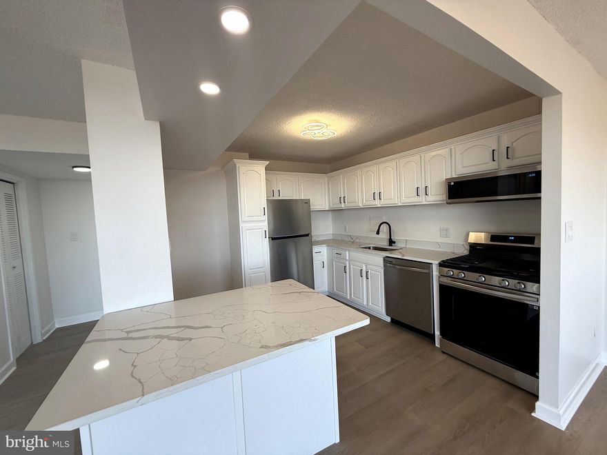 Step into this stunning condo featuring a modern open kitchen equipped with brand-new appliances and waterproof laminate flooring throughout. Enjoy the mesmerizing sunsets from your private balcony. The community offers fantastic amenities, including an outdoor pool, playground, fitness center, and a convenient store on the lower level. With easy access to I-95 and I-495, commuting is a breeze. Plus, the University of Maryland shuttle stops right in front of the condo, making it a quick 10-minute ride to campus. With all utilities included, this condo provides exceptional value.