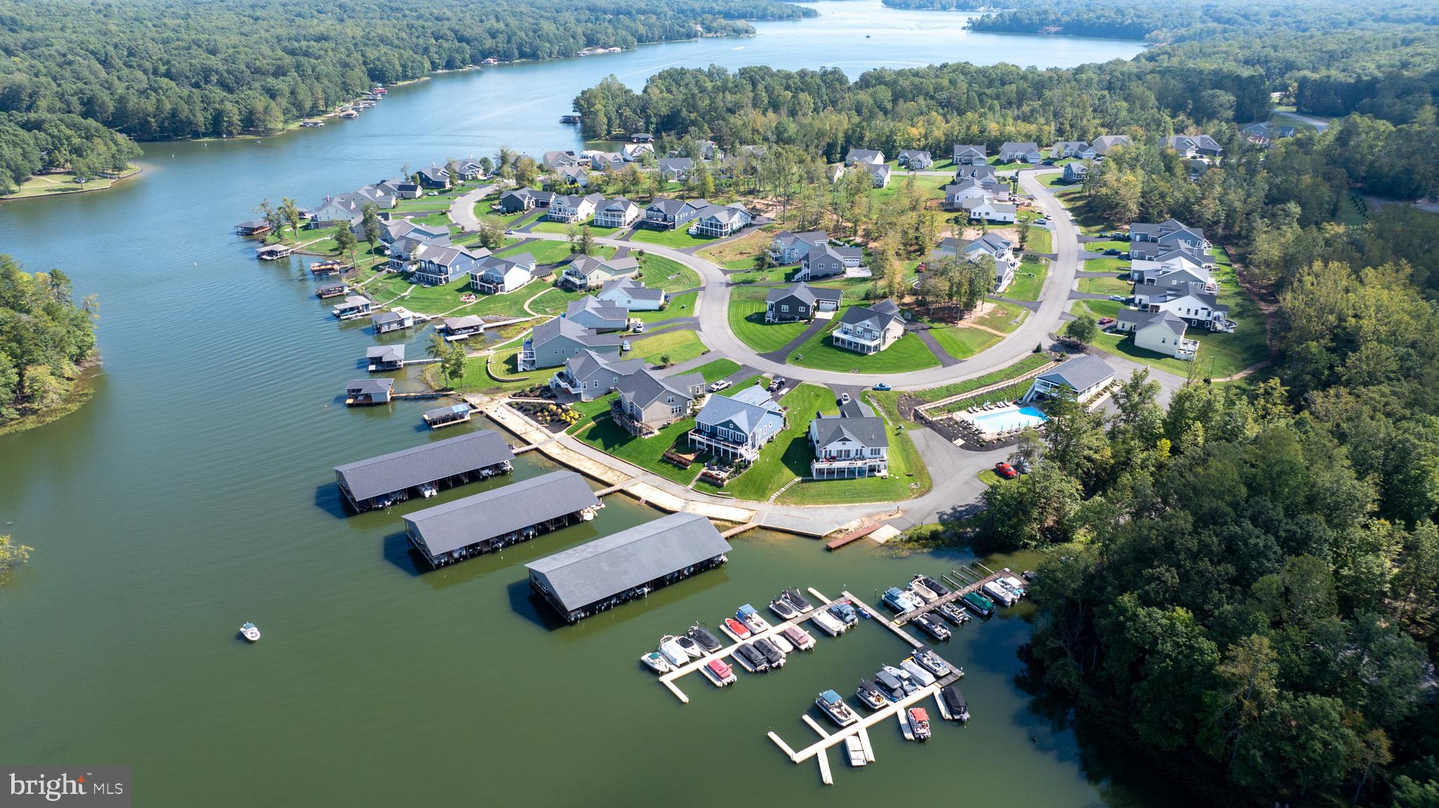 Private showing available with 20 minutes notice all weekend
Discover the Sunset Plan—offering the amenities of a larger home in a thoughtfully designed, manageable footprint. The Public Side of Lake Anna. Sunset Cove Model available for tour!
The open-concept design features two-story glass windows, flooding the home with natural light. A spacious foyer with elegant oak stairs welcomes you inside, leading to a formal study, which can be converted into a second bedroom for added flexibility.
The family room is bright and inviting, featuring an active dormer window that enhances the space with natural light and architectural charm. The dining area, located at the rear of the home, boasts a box ceiling and a working island, perfect for entertaining. The kitchen is loaded with cabinetry and features an oversized walk-in pantry, providing ample storage for your lake retreat. A second full bath on the main level ensures extra comfort for guests.
The main-level master suite is a true retreat, offering a soaking tub, dual vanities, a water closet, and a spacious walk-in closet. Huge glass doors open to your private deck, seamlessly blending indoor and outdoor living while overlooking the serene common area.
Upstairs, the loft area offers breathtaking views of the private backyard and includes two additional bedrooms, two full bathrooms, and a flexible open space—ideal for a lounge, office, or play area.
A full basement is ready for your personal touch, with pricing available to finish all or part of the 4,128 sq. ft. to suit your needs. Larson Custom Homes is ready to customize this space to match your lifestyle.
A finished model home is available for viewing across the street, and additional lots are available for the Sunset Plan or other models in Sunset Cove.
Sunset Cove is known for its private covered boat slips, pool, full gym, and vibrant year-round community. Enjoy exclusive access to the private members-only clubhouse, complete with beer on tap, personal club lockers, and a calendar full of events. Plus, with lawn care included in the HOA, you can spend more time relaxing at beautiful Lake Anna.
Come see for yourself why Sunset Cove is lake living at its best!