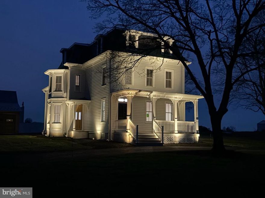 A stunning and sophisticated complete restoration of a treasured historic home built in 1877, Rose Lawn is one of the most prestigious homes in Forest Grove Village.  This beautiful 3-story house provides the benefits and peace of mind of new construction and it is ready to move into.  Lovingly restored by Nick Lykon who has completed other outstanding renovations of vintage homes, his vision was to take the architectural characteristics & ambiance of the house and  blend it with modern amenities and luxuries to create a home of exceptional beauty & style.  Many of the original period details remain and were matched where needed by custom millwork of outstanding craftmanship.  What was created is a seamless blend of the elegant architectural features that were part of this distinguished home when built plus new infrastructure parts including the roof, siding, plumbing, electric, HVAC, fire protection, and septic system. Imagine holidays in this gorgeous house!  Highlights include the original staircase that gracefully winds up to the third floor, the intricate millwork, original floors, new Marvin Elevate windows and doors (there is one remaining original window with a story), rebuilt barn and garage/workshop.  From the foyer you enter a living room with a two-sided fireplace that is also enjoyed in the family room.  Huge windows are everywhere and let in natural light and the views and beauty of changing seasons.  The family room spans the width of the house and is shared by a formal dining room at the other end.  In the middle is an incredible, original 8' pocket door. The three large main floor rooms give you the choice of how to use them for your lifestyle.  A large eat-in kitchen with wonderful Quartz counterspace and  lots of custom cabinetry is a chef's delight that combines convenience, function, and beauty. Plenty of space to hang out and to prepare food for a small or large gathering.  A door opens to the rear and  the  covered exterior  entrance to the basement.  Two staircases- the grand one in the foyer and a back one from the kitchen-take you upstairs to the first of two levels of bedrooms and bathrooms.  The two upper floors have six bedrooms and 3 full bathrooms.  The spacious primary suite has a propane fireplace, bathroom,  large walk-in shower, and there is also a room sized closet. There are two other bedrooms and a shared bathroom on this level that includes a cast iron tub next to second floor laundry.  The third floor has three more bedrooms: 3rd floor laundry and a bathroom.  The rebuilt 2-level barn is an extraordinary opportunity for use.  The large space has three huge chandeliers that set the stage for your personal needs and pleasure and /or for a business opportunity.  It could be the quintessential event and party space, a showplace for a car collection or any of many zonings potential uses.  The lower level was built to be completed for farm animals, equipment or your car collection whatever you want or need.  The 4.7 acres give you control of designing your outdoor amenities.  Or, you can even rent part of the land to a farmer.  And, there is a possibility to subdivide the land and build a second home.  Rose Lawn is not an ordinary residence or property.  It has grace, size, a historic provenance, a great location and unquestionable beauty.  You can live in the central part of Bucks County and enjoy its amenities.  Ideally located near Doylestown, New Hope, and Newtown that have shops, boutiques, restaurants, a movie theater, live performance venues, a train station and parks.  This special property has it all...welcome home!