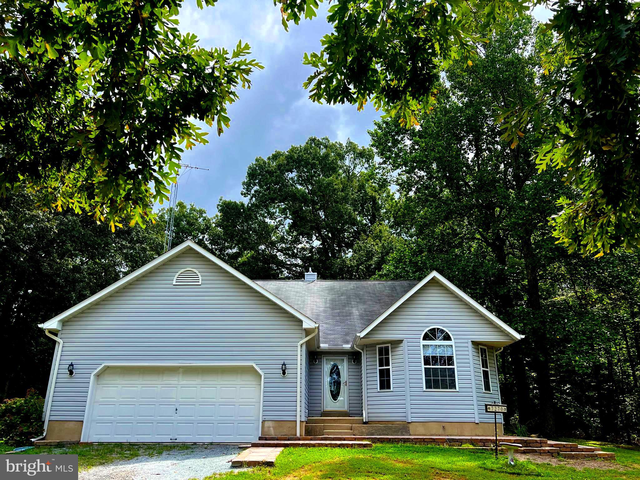 Welcome to this beautifully maintained 3 bedroom, 2.5 bath Custom Built Home nestled on 1 acre in a peaceful setting with a private wooded backdrop. This home offers a perfect blend of classic design and modern comforts, ideal for those seeking tranquility without sacrificing convenience. This spacious three level single family home encompasses approximately 3,103 square feet of living space. The Main Level boasts a two-story living room, cozy decorative fireplace/pellet stove and a dining area perfect for gatherings and relaxation. The well-appointed kitchen features a JennAir cooktop, island, double-wall oven and plenty of cabinetry. There are 3 generously sized bedrooms including a full hall bath and primary suite with an en-suite bath and walk-in closet. The Upstairs welcomes you with a spacious loft area with overlook to the 2-story family room, a separate large den/entertainment/craftroom/office that is adorned with hand crafted built-ins, a half bath and plenty of storage closets. This home includes a two-car garage and an unfinished basement ready for your personal touch with plenty of room for storage. Step out into the screened-porch that leads to patio pavers and take in the serene views of the lush woods, offering a perfect setting for morning coffee or evening entertaining. Don't miss the opportunity to make this your new home!