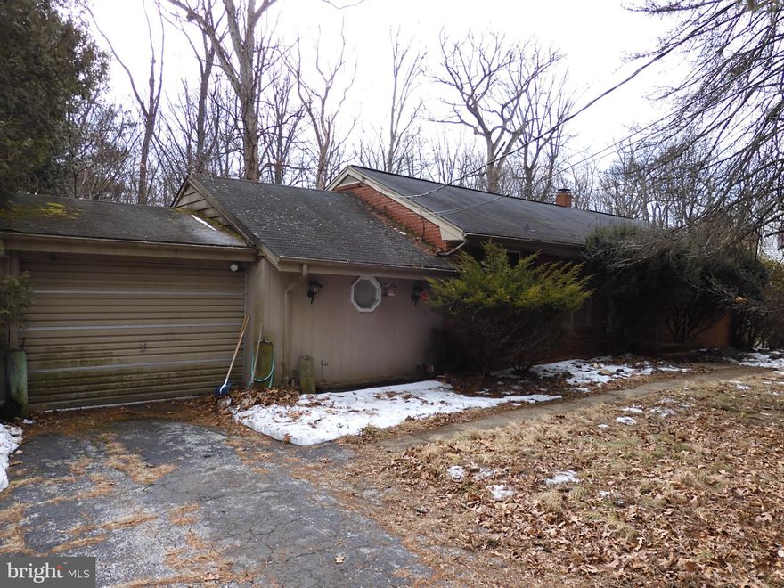 A remarkable opportunity for a total rehab! The house has good bones but needs work. Bring your imagination! The garage and workshop addition add lots of potential. A great, convenient location surrounded by nice homes! The back yard has trees and backs to woods. The oil furnace and well pump are around 3 years old. Owned by one family for many years, this home is waiting to be restored. You could be the one to do it! Sold as-is,