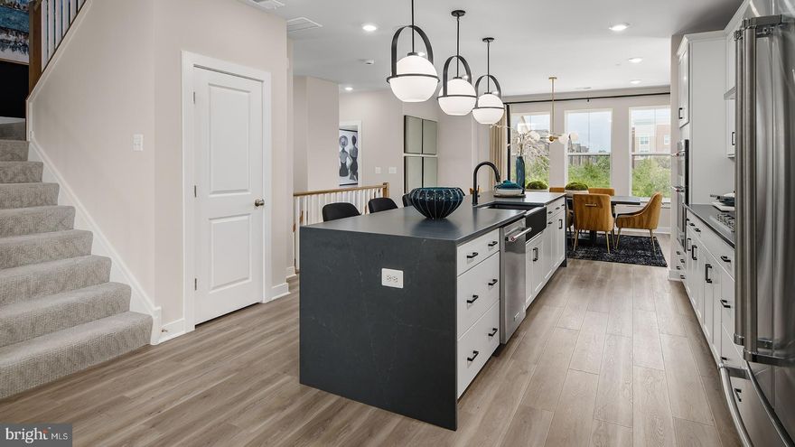 **OFFERING UP TO 20K IN CLOSING COST ASSISTANCE WITH USE OF APPROVED LENDER AND TITLE.**
Enter the Clarendon from either the main front entrance or the private entrance through the rear garage. Both entry points lead to the main living level which opens to the dining room and an adjacent powder room. The center kitchen showcases an open design with upgraded stainless steel GE Profile/Energy Star Appliances, a pantry, and an oversized 12 ft. island. Continue to the rear of the main level, where the great room seamlessly connects to an outside covered lanai with natural stone exterior gas fireplace. The primary suite includes an enormous walk-in closet and an ensuite bath equipped with a dual sink vanity, a walk-in shower with a seat and a private water closet. Additionally, there are two generously sized secondary bedrooms, a full bath with a dual sink vanity, and a conveniently placed laundry room on the upper level with a wash basin and included washer and dryer. Continue up to the impressive rooftop terrace, the perfect spot for morning coffee or evening entertaining. *Photos may not be of actual home. Photos may be of similar home/floorplan if home is under construction or if this is a base price listing.