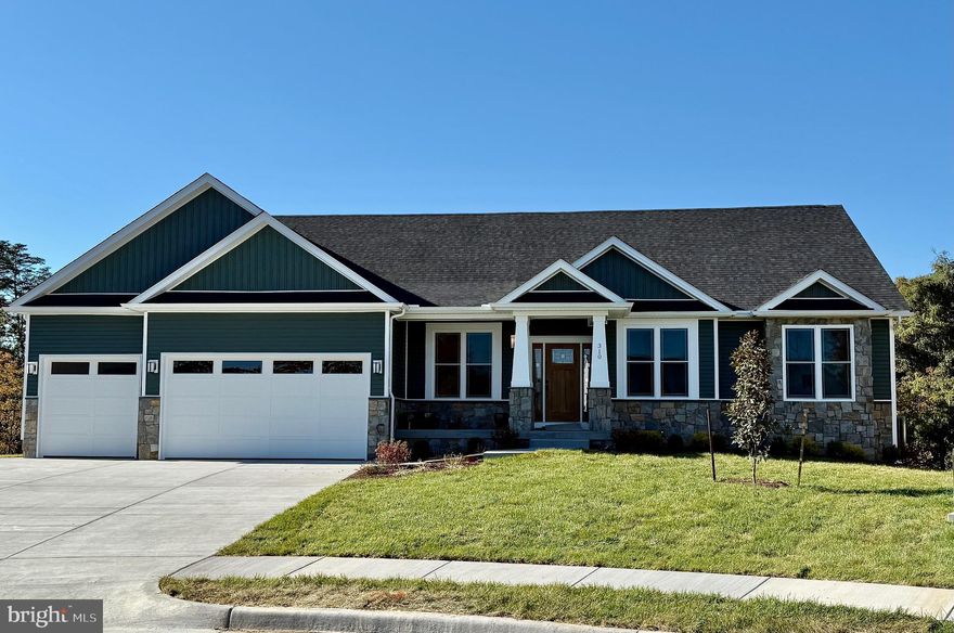 Chance to build a home on maybe the last lot directly on Winchester Country Club golf course.  This 1/2 acre lot is gently sloping (allowing for walk-out basement) with mature trees and open views to the 6th, 11th and 12th hole of WCC.  Offered is the 3-car Fraser Model by Merrifield Homes.  This open layout, open floorpan, features 3 bedrooms on the first level with 2 baths.  A full 1,000 sq. ft. basement is included with another bedroom, full bathroom and large media room.  All men of brick/stone and hardiplank siding, the home will also feature customized kitchens, baths and hardwood throughout.  Choices are virtually limitless, and changes to floorpan are allowed, within the boundaries of the house.