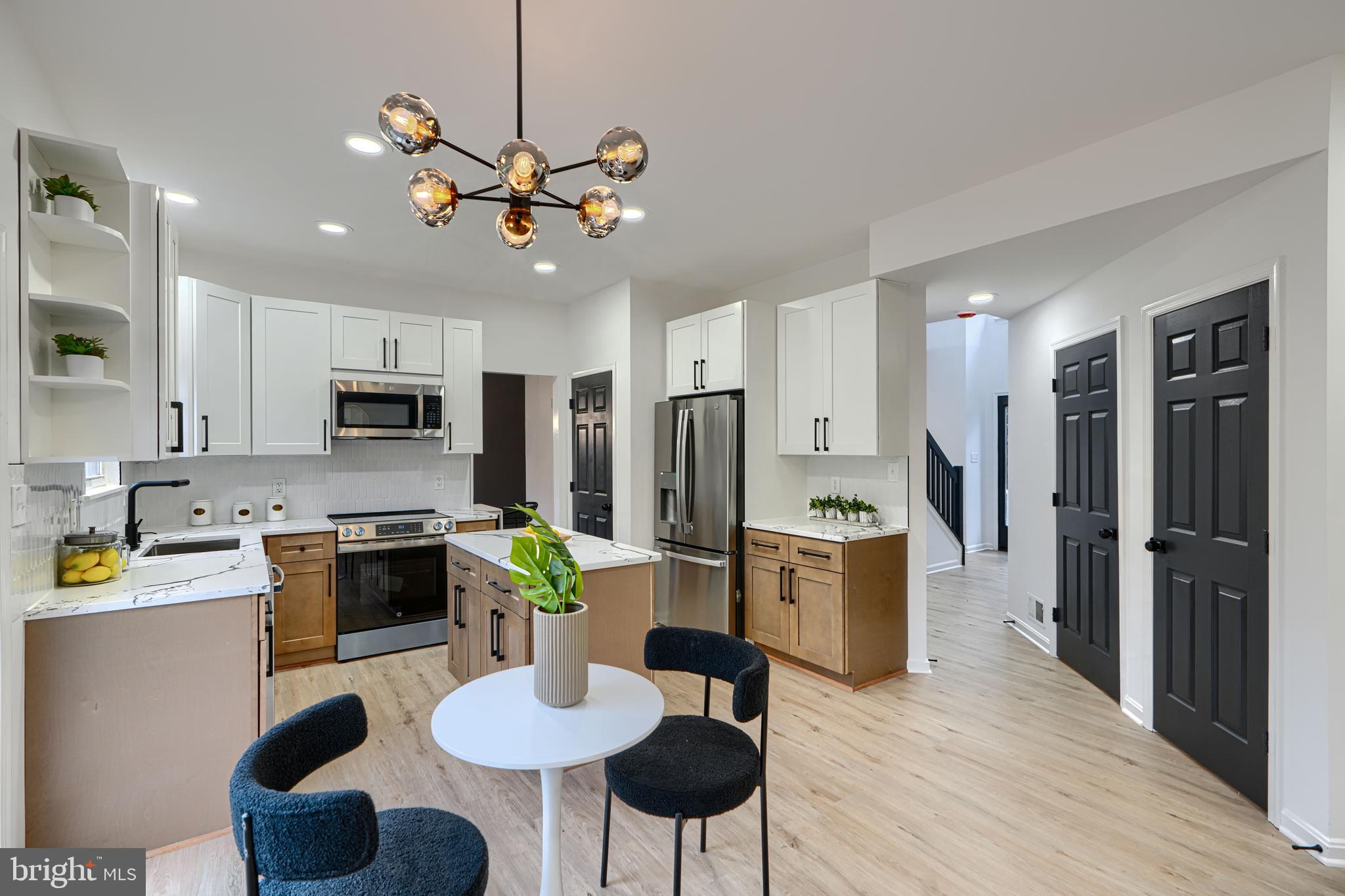 Welcome to 900 Academy Dr—an updated showstopper in Owings Mills! Enter into a grand 2-story foyer with a stunning chandelier. The main level features a seamless flow from formal living to dining, leading to a gourmet eat-in kitchen with two-tone soft-close cabinets, quartz countertops, stainless steel appliances, and an island. Step out onto the spacious deck or relax in the large family room with a custom-tiled fireplace. Upstairs offers 4 bedrooms and 2 full baths, including a luxurious primary suite with dual walk-in closets, spa-like bath, soaking tub, walk-in shower, and private water closet. Situated on a large lot, this home also features a 2-car garage, driveway, and an unfinished basement with endless potential!