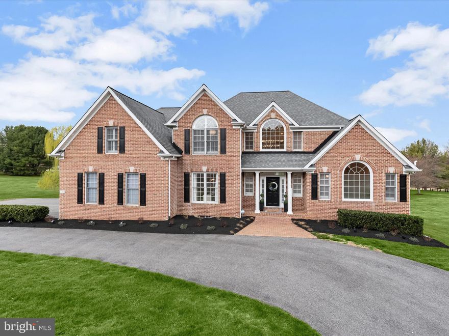 *Offer deadline 4/28 at noon*
Nestled on a picturesque one-acre lot in the desirable Fox Valley Estates community, this incredible brick colonial has been thoughtfully reimagined with over $300,000 in updates. A circular driveway welcomes you home, leading to an attached three-car garage with pristine epoxy flooring. Located on a peaceful cul-de-sac, this legacy home boasts design-inspired interiors and breathtaking sunset views over rolling pastureland and neighboring horse farm.
Step into the impressive two-story foyer, where a striking candelabra chandelier and a modern turned staircase set a grand tone. To the left, the formal dining room showcases crown molding and chair railing, while ahead, the formal living room dazzles with soaring two-story ceilings and dramatic windows that flood the space with natural light. At the heart of the home, the gourmet kitchen is a chef’s dream, featuring white cabinetry with dentil molding, a glass tile backsplash, granite countertops, a spacious island with a breakfast bar, high-end Z Line stainless steel appliances, a walk-in pantry with custom organizers, and stylish new hardware and fixtures. Adjacent to the kitchen, the breakfast room’s cathedral ceiling and deck access provide the perfect spot to enjoy morning coffee with an uninterrupted view of the horse farm. The FR is a breathtaking retreat, complete with a two-story vaulted ceiling, a floor-to-ceiling brick fireplace, and two expansive picture windows that frame the stunning landscape. The main-level primary suite is a private sanctuary, offering a spacious bedroom with a cathedral ceiling, an attached sitting room with French doors, and tranquil views of the farm. Luxuriate in the en-suite bath, which features a double vanity, a soaking tub, a separate shower, and custom wooden plantation shutter blinds. Two walk-in closets with custom built-ins complete this elegant space. Two staircases lead to the upper level, where four sizable bedrooms await. Two bedrooms share an attached bath with a double vanity, while the third and fourth bedrooms share a dual-entry bath. Custom closet systems enhance three of the four bedrooms, and each space is adorned with new lighting, mirrors, and freshly painted vanities.
The fully finished lower level is a showstopper, accessible from both the kitchen and the foyer. This expansive space boasts a sprawling recreation room, a full bath, a private exercise room with commercial-grade flooring, and a luxurious theater room. With a walkout to the backyard, this level is as functional as it is impressive.
Outdoor living is just as exceptional, with a newly installed composite deck featuring glass panels designed to maximize the breathtaking views. Additional exterior enhancements include a professionally installed Hi-K video and audio monitoring system, a Ring Alarm doorbell, upgraded exterior lights, an invisible fence with monitors, and over $10,000 in professional landscaping. The garage is equipped with a WiFi-enabled door, video monitoring, and a workspace with additional shelving.
Throughout the home, meticulous upgrades enhance both form and function. Every room has been freshly painted, with new LVP flooring, modern hardware, and stylish lighting fixtures. All door hinges, outlet covers, and toilets have been replaced, and the foyer staircase has been redesigned with updated spindles, freshly painted railings, and a brand-new chandelier. Smart features include WiFi-enabled garage openers, touch keypads, and remote-controlled custom blinds in multiple rooms.
Major system upgrades include a new water heater (July 2024), furnace (June 2020), a pumped and serviced septic system (December 2024), and a Landmark Pro Shingle roof installed in April 2014 with a warranty.
A true masterpiece of thoughtful design and meticulous updates, this extraordinary home offers unparalleled elegance, comfort, and security in a coveted community setting. Don’t miss your opportunity to experience it firsthand.