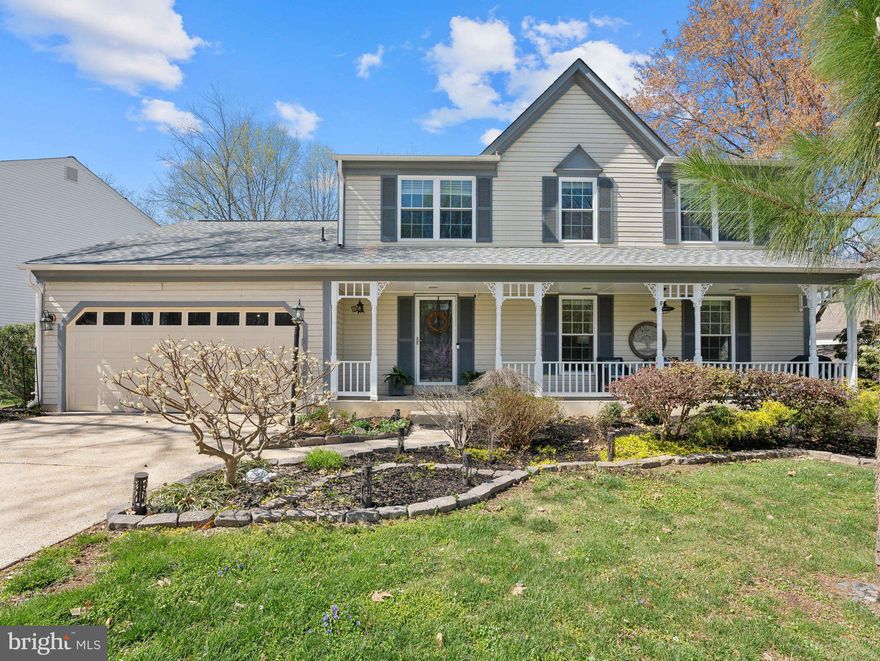 Gorgeous 4 bed, 2.5 bath single family home on a quiet cul-de-sac in Lake Ridge. Covered front porch and fully fenced-in rear yard with walk-down deck. 2-car garage with additional storage/workshop space. Kitchen was fully remodeled in 2016 with quartz countertops, stainless steel appliances, island with seating, new cabinetry, farmhouse sink, and pendant lights. Dining room off the kitchen with bay window. Main level hardwood floors replaced in 2016. Inviting foyer with iron railing on the staircase. Main level half bath, wood burning fireplace, and laundry/mud room off the garage. Four spacious bedrooms on the upper level. Primary bedroom has renovated bathroom, recessed lights and walk-in closet. Upper level hall bathroom remodeled in 2016. Unfinished basement has over 1,100 sq ft including a bathroom rough-in and rear walkout to the backyard. Updates include: HVAC 2019, water heater 2019, architectural shingle roof and gutter guard 2016, windows 2017, basement electrical panel 2018, sump pump 2016, rear fence 2016, thermostat 2019, deck stain 2025.