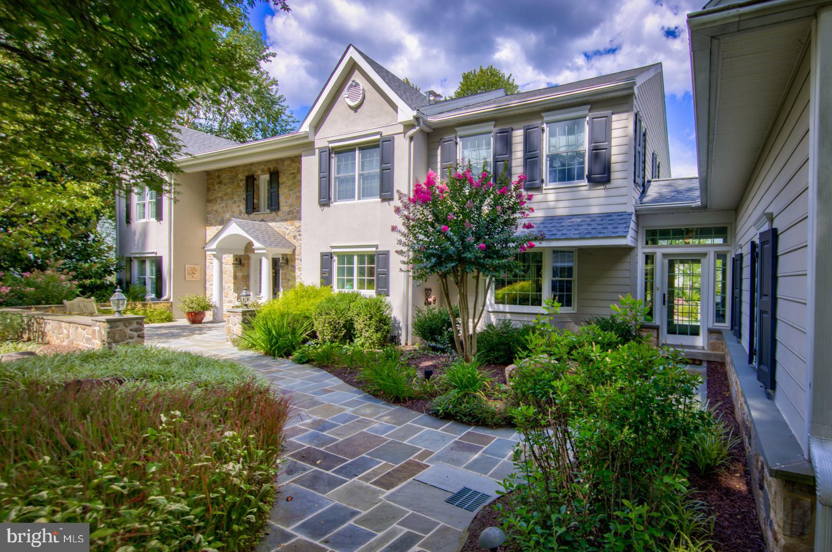 This is the house that you have been waiting for, located in the estate section of Devon, Tredyffrin Easttown School District, low taxes - $17,292/year, within walking distance to the Devon Train Station, Terrain and Anthropologie. The beautifully landscaped one acre lot, with pool & flagstone patio with fireplace & built-in grill area make this a great place to entertain or just relax after a long day...
Over the last 26 years the sellers have renovated and added on to the original house to make it what it is today...make an appointment today to see it...
1st floor: Enter into the Foyer from the flagstone courtyard; this 2 story entry has views to the outside thru the sliding doors in the Living Room; step down to the Living Room which has two seating areas, one with a wood burning fireplace, access to the Dining Room for perfect flow when entertaining, and the other a step up to game area which has french doors to the Office and also sliding doors to the Patio. The Office has a wall of built-ins for storage and 2 large windows for light. Back to the Foyer there is access down a hall to a Half Bath; then a large Butler's Pantry/Bar Area with sink, beverage refrigerator drawers, and wine refrigerator, this also opens to the Dining Room and to the Kitchen. The Dining Room has sliding doors to the back Patio. The Kitchen Area extends the width of the house with windows on both ends and also a door to the Patio. The gourmet Kitchen features a Wolf range, built-in microwave, built-in refrigerator, island that seats 4 and has extra storage on the other side, a pantry wall, Breakfast Area for a table, and a built in Desk Area. Off of the Kitchen is a Breezeway area that has access to the front & back yard, thru the Breezeway is a Half Bath, access to the Family Room and Game Room above the 3 Car Garage and access to the Garage. The Garage has 3 separate doors with openers and a man-door all opening to the circular driveway, there is extra storage space, a closet for the trash cans and two custom coat/storage cabinets.
2nd floor: There are 2 Primary Suites, the 1st one is at the top of the stairs which is original to the house, it has a walk-in closet and an updated Full Bath with tub shower and pedestal sink. The 2nd Primary Suite is at the other end of the hall, which was added by the sellers, with a vaulted ceiling, 2 walk-in closets, Full Bath with stall shower, soaking tub, double vanity and linen closet. There are 2 other Bedrooms that share a Hall Bath, which has a tub shower & double vanity.
Lower Level: Family Room, Exercise Room with access to cedar closet and Kitchenette area, Laundry Room with wall of cabinets and folding area, unfinished utility area off of the Laundry Room.
Outside spaces: Flagstone walkway & courtyard in the front, Flagstone Patio with wood burning fireplace & built-in grill area, salt water heated Pool, Storage Shed, irrigation system.
Updates: Roof 2023, water heater 2025, heating/ac system 5 zones 2023, outside fireplace area & built-in grill, flagstone patio repointed 2021, 2 coat/storage cabinets added in the garage 2020, new whole house Generator 2021, lawn & garden irrigation system.
