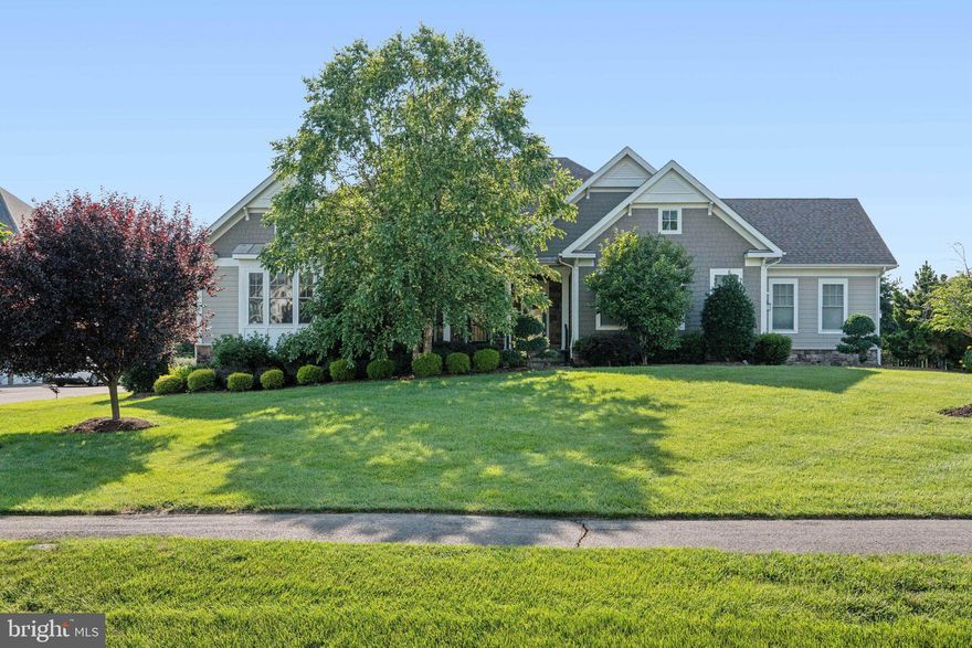 Welcome to a stunning Arcadia Kavanagh estate, perfectly situated on a premium 0.75-acre lot backing protected conservation land in one of Northern Virginia’s most prestigious communities—The Grant at Willowsford. Thoughtfully designed with over 6,500 square feet of luxurious living space across two expansive levels, this exceptional raised ranch-style home offers unparalleled comfort, elegance, and privacy.  

From the moment you step inside, you’ll be captivated by the home’s refined craftsmanship. Soaring 10-foot ceilings, rich espresso-stained hardwood floors, and intricate moldings set the stage for timeless sophistication. At the heart of the home, the gourmet kitchen makes a bold statement with upgraded white raised panel cabinets with end panels, high-end appliances, including a Wolf exhaust hood, gas cooktop, wall oven, convection oven, built in microwave drawer and a SubZero fridge - all complimented by gleaming granite countertops, and a striking mosaic tile backsplash. The expansive center island provides plenty of prep space and extra storage, making it as functional as it is beautiful.

Ideal for both everyday living and elegant entertaining, the open-concept layout features a spacious dining room, living room, and a light-filled family room with a sleek built-in gas fireplace and sliding glass doors that open to the elevated deck.

Designed for effortless main-level living, the luxurious primary suite is a true retreat, complete with tray ceilings,  a morning bar, two customized walk-in closets, and a spa-inspired bathroom boasting a soaking tub, frameless glass shower with dual shower heads, upgraded tile work, and separate vanities. Two additional generously sized bedrooms on the main level each offer walk-in closets and private en-suite bathrooms.   A well-appointed laundry room with built-in cabinetry and utility sink adds to the home’s thoughtful design.

The fully finished walk-out lower level is bathed in natural light and built to impress. Entertain with ease in the expansive recreation room complete with a gas fireplace, a custom wet bar with a beverage fridge and built-in microwave and a nearby half bath. This level also includes a fourth bedroom suite with its own upgraded full bathroom and walk in closet—perfect for guests or multi-generational living—as well as an oversized storage room for all of life’s extras.  The upgraded water heater is approx. 1 year old.

Step outside to your own private oasis. The professionally landscaped backyard features an elevated composite deck with stairs down to a beautiful flagstone patio, and serene views of the surrounding preserve, offering year-round tranquility and unmatched privacy.

Located within the award-winning Willowsford community, residents enjoy access to resort-style amenities, scenic trails, lake activities, a community farm, and top-rated Loudoun County schools—all just minutes from major commuter routes, shopping, and the Ashburn Metro.

This is more than a home—it’s luxury living without compromise.