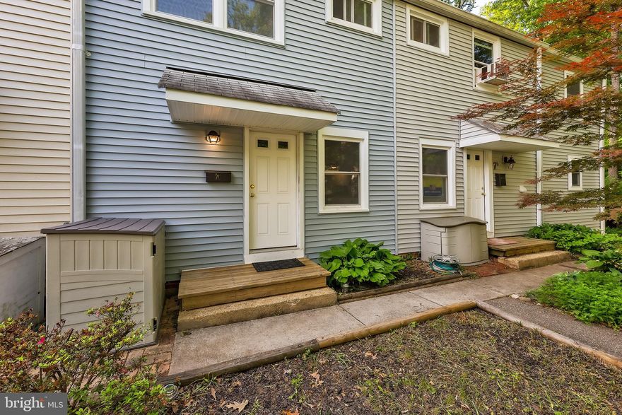 Welcome to 7-C Plateau Pl., at the quiet, leafy end of the street. This charming home features an inviting open floor plan, ideal for modern living. The updated kitchen boasts sleek countertops and contemporary appliances, perfect for culinary enthusiasts. Upstairs, you'll find two nicely sized bedrooms offering ample closet space and a renovated bath, providing both comfort and style. Conveniently located on the first floor, a laundry room equipped with full-size appliances adds to the ease of daily life. The  exterior features a serene patio, offering tranquil views of the deep woods and encompassed by the breathtaking Greenbelt Forest Preserve. Out front, the reserved parking space is right in front of the unit. This delightful residence seamlessly combines functionality and natural beauty, providing a truly enchanting living experience.
This is a co-op, see ghi.coop for information about the community. Cash or conventional financing only, with GHI approved lenders. Co-op fee includes PROPERTY TAXES, insurance, and major exterior and interior maintenance.