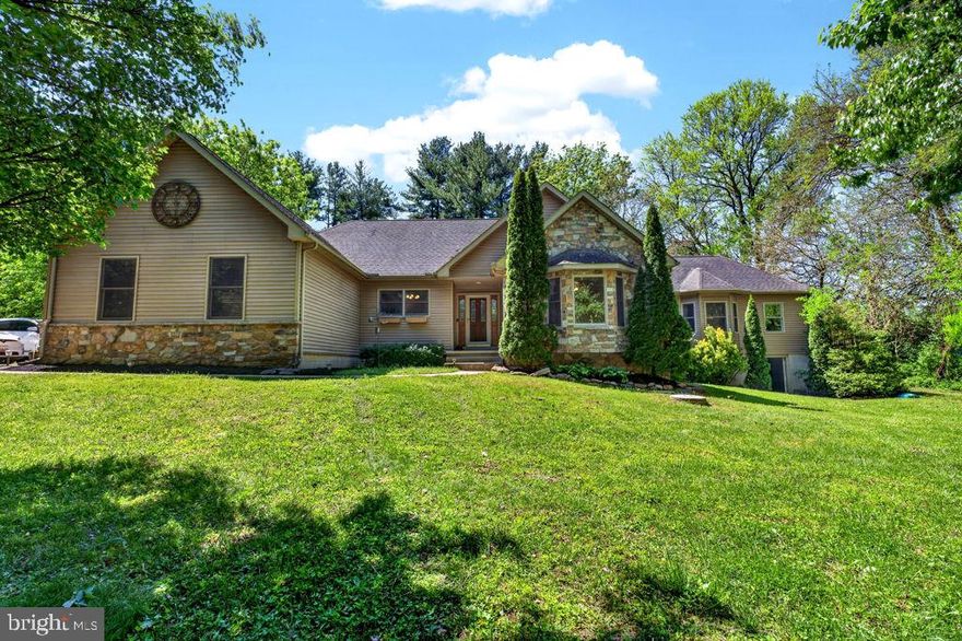 Tucked away in desirable Fair Hill, this impeccable custom-built contemporary ranch offers the perfect blend of space, style, and versatility all with NO HOA! Built in 2003 with a thoughtfully designed private addition completed in 2009 this stunning home features 4 bedrooms, 3 full baths, and an expansive open floor plan ideal for everyday living and entertaining. Step inside to soaring cathedral ceilings, skylights that flood the home with natural light, and a warm wood-burning fireplace in the spacious living room. The kitchen boasts an abundance of cabinetry, generous counter space, and excellent storage with the convenience of a main level laundry area just off the kitchen.
The bright dining area flows seamlessly into the sunroom creating the perfect spot to relax and enjoy peaceful backyard views year round. The luxurious primary suite offers a spa like bath complete with a soaking tub, separate shower, double vanity, and large walk-in closet. A second private suite with its own full bath provides ideal accommodations for guests or family. The addition offers incredible flexibility with a private outside entrance, deck, living room, full bath, and bedrooms perfect for an in-law suite, extended family, guest retreat, or home office setup.
Additional features include a fenced rear yard, shed, greenhouse, oversized 2-car garage, and a huge basement with tall ceilings and rough-in for a future bath, offering endless possibilities for additional living space. New furnace and updated flooring. Conveniently located just minutes from Newark, Delaware, Pennsylvania, Fair Hill Natural Resource Area, shopping, dining, and commuter routes — this one-of-a-kind home truly has it all!