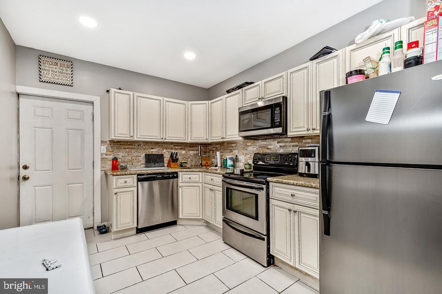 Welcome to this  stunningly renovated home featuring an open-concept layout,  exposed brick, the kitchen leading to an inviting deck—perfect for your morning coffee. This home offers three generously-sized bedrooms and two complete bathrooms. Additionally, there is a fully finished basement, adding ample space for relaxation or entertainment.