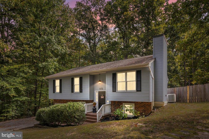 Beautifully updated and move-in ready, this 4-bedroom, 2-bath home offers comfort and modern convenience throughout. Enjoy brand-new flooring in bedrooms and throughout the basement, a recently renovated bathroom, and a stylish custom coffee bar. The kitchen features new appliances, while the large laundry room and attached single-car garage add functionality and storage space.

The finished lower level includes a bedroom that can also serve as a flex space—ideal for a home office, gym, or guest suite. Outside, the spacious, fenced backyard provides the perfect setting for relaxation or recreation.

Located within a gated community offering premier amenities to include pool, fitness center, boat dock and ramp, playgrounds, volleyball and basketball courts, and water access. Road maintenance, snow removal, and 24-hour security are all included for peace of mind.