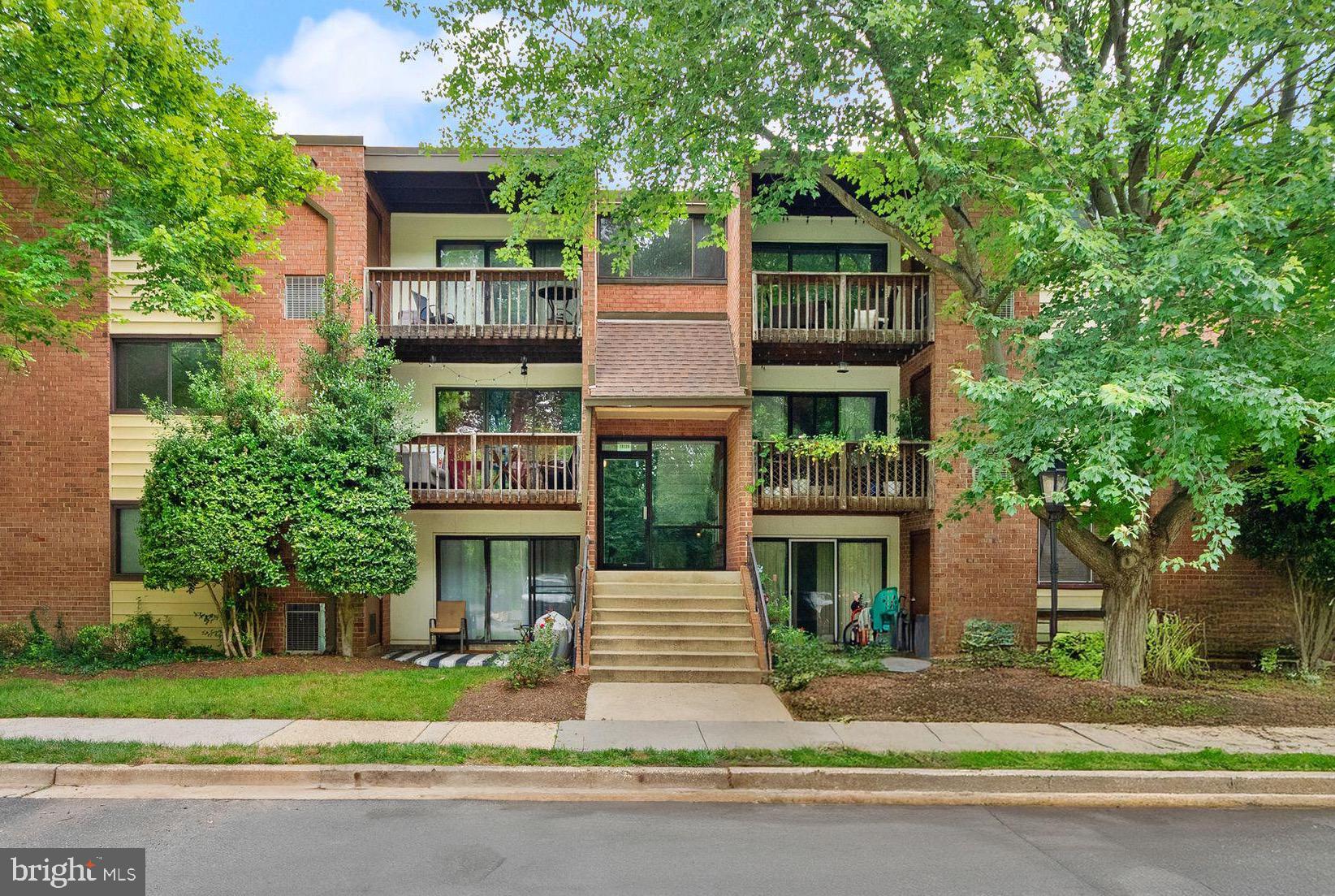 Welcome to this beautifully maintained and spacious two-bedroom plus den condo, ideally located just steps from George Mason University, farmers markets, restaurants, and entertainment. Inside, you'll find generously sized rooms, including a separate dining area off the kitchen and a large primary bedroom with a spacious walk-in closet. The living room opens directly to a private patio and lush common area—perfect for relaxing or entertaining. The condo has been freshly painted and features stainless steel appliances, including a newer gas stove, large refrigerator, and dishwasher. All utilities are included in the condo fee, making budgeting simple and hassle-free. Additional highlights include a dedicated storage unit, one reserved parking space, and access to scenic walking trails, a large playground, and a beautiful park setting right across the street. Enjoy unmatched convenience with easy access to bus stops, major commuter routes, and the Vienna Metro via the nearby Q Bus. Don't miss this rare opportunity to enjoy both comfort and convenience in the heart of Fairfax! - Please note: select photos have been virtually staged to help visualize the property's potential.