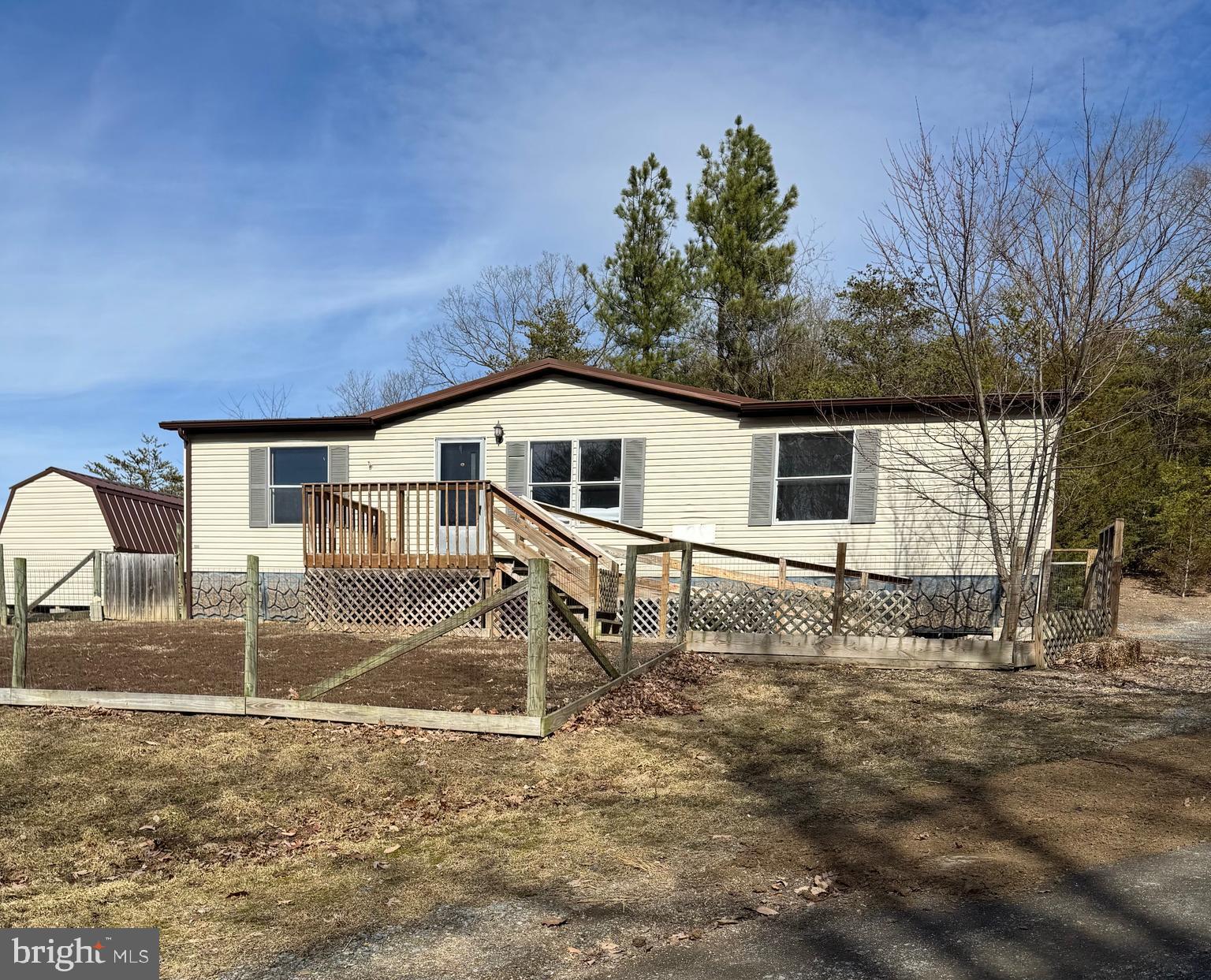 This 3 BD/2BA home is located on over an acre of rural land near to both the towns of Moorefield and Petersburg. Conveniently located near to schools, shopping, and medical facilities. An addition has been made to a manufactured home to add to the living space. New survey of the land and the interior has just received a fresh coat of paint. Small storage building is included in the purchase. Schedule a showing to see the nice setting.