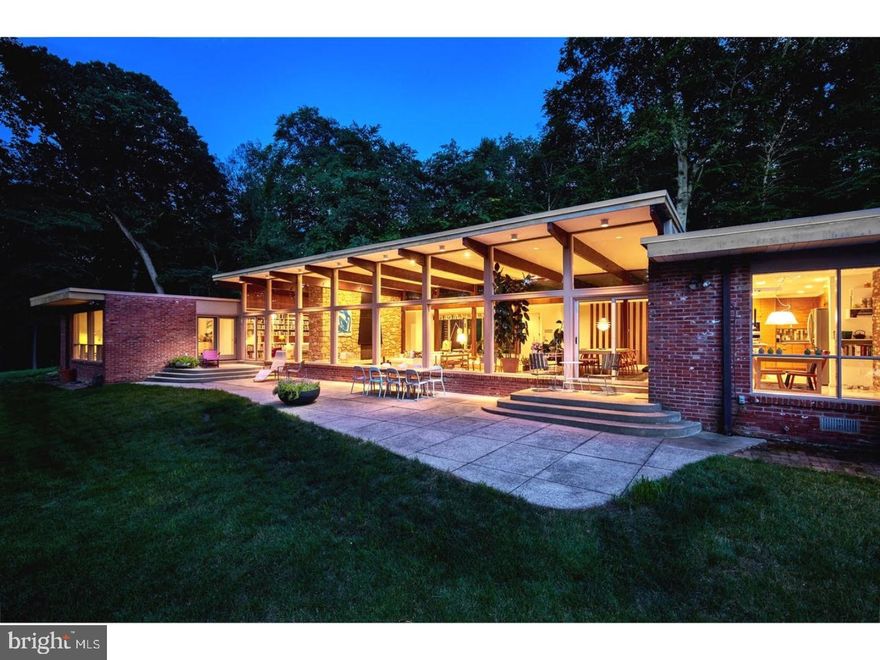This truly spectacular Modern home designed by George Smith an architect who worked in the office of Louis Kahn and Oscar Stonorov?and built in 1959 is on the market for the first time since its remarkable restoration. This home is among the best examples of the "glass box" in mid-century American architecture, dissolving the divide between inside and outside. The center of the home is the large open-concept living room and dining room with a dramatic hilltop view overlooking protected woodland. Each of the four seasons can be enjoyed in complete privacy with no other homes in sight. The family room, kitchen, breakfast area, and master bedroom have floor-to-ceiling walls of glass, and the home's extensive clerestory windows also emphasize the high ceilings and the connection to the outside. Every detail of the 4-bedroom, 4-bath home has been beautifully restored. The kitchen and bathrooms have undergone gut renovations. The original terrazzo floors found in all the major rooms have been restored to their full glory. The work continued outside with beautiful retaining walls, plantings, fencing around the nearly two-acre property, and a complete restoration of the large keystone-shaped pool. Additional improvements include a new EDPM roof and new insulated windows. The home's location, a quick 15-minute drive into the heart of Philadelphia, is in top-rated Lower Merion School District and near the full array of shopping and restaurants the Main Line has to offer. A truly remarkable and rare opportunity to own a significant work of architectural importance, restored with the highest possible integrity, and in an incredible location.
