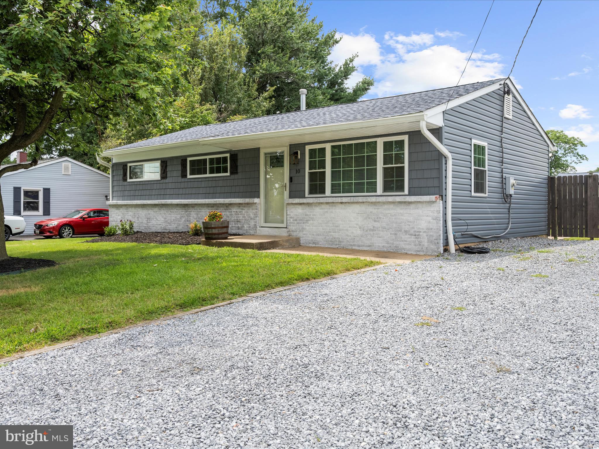 Welcome home to this charming and thoughtfully updated property featuring an open-concept living and dining area, perfect for entertaining. The spacious kitchen boasts a large shiplap-wrapped island with seating, a stylish barn door pantry, and a double gas oven with an option for electric cooking. Upstairs you'll find two generously sized bedrooms and a full bathroom. The fully finished basement offers a private primary suite for added comfort and space. Enjoy peace of mind with brand new windows and siding (2024), plus a newer roof and gutters (2020). The fully fenced backyard is a true outdoor retreat with twinkle lights, a cozy firepit, a large shed, and gated access. Ample off-street parking. Ideally located near shopping, major highways, and just minutes to Baltimore, BWI, Annapolis, Ft. Meade, Northrop Grumman, and more!